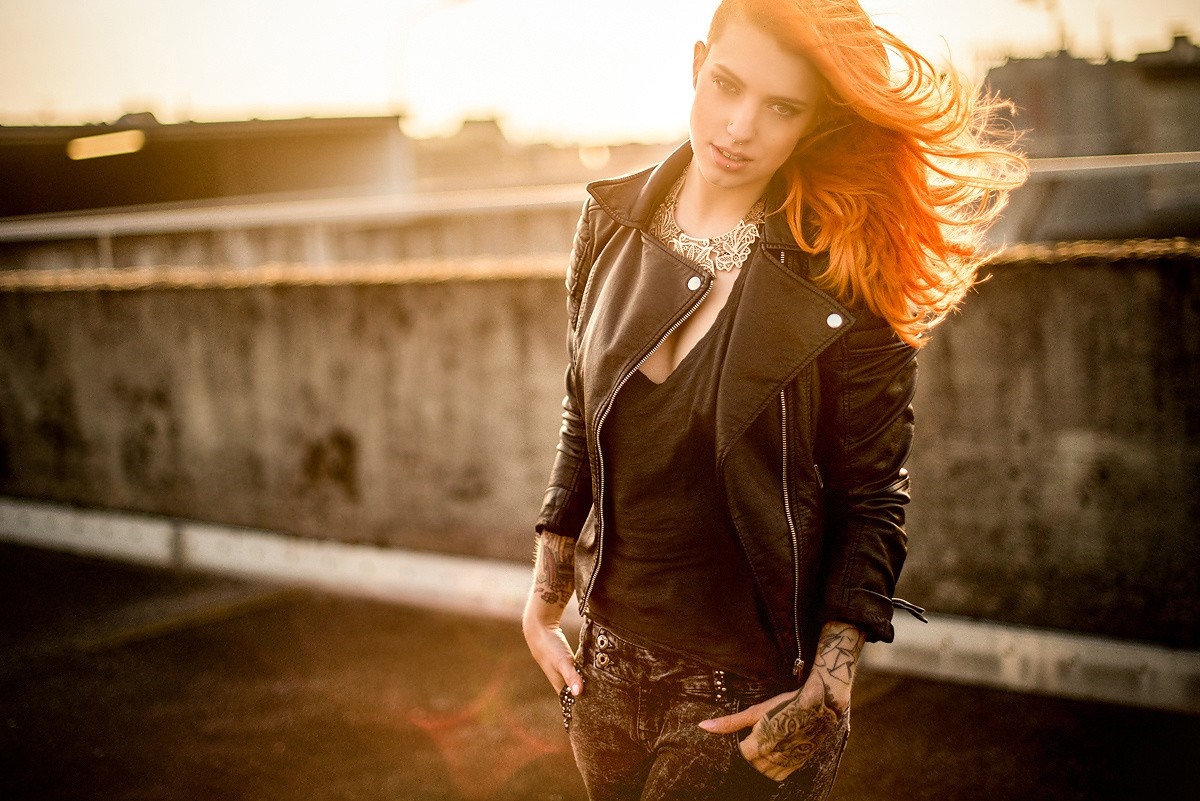 Woman with red hair wearing a leather jacket HD Wallpaper