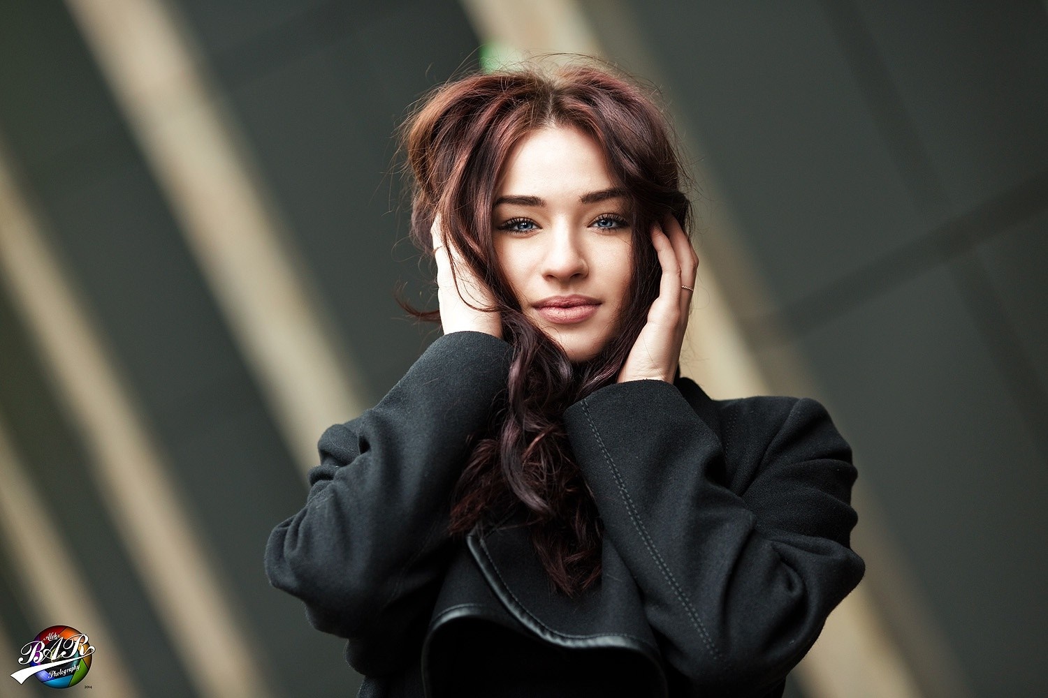 Woman with dark hair in a black coat HD Wallpaper