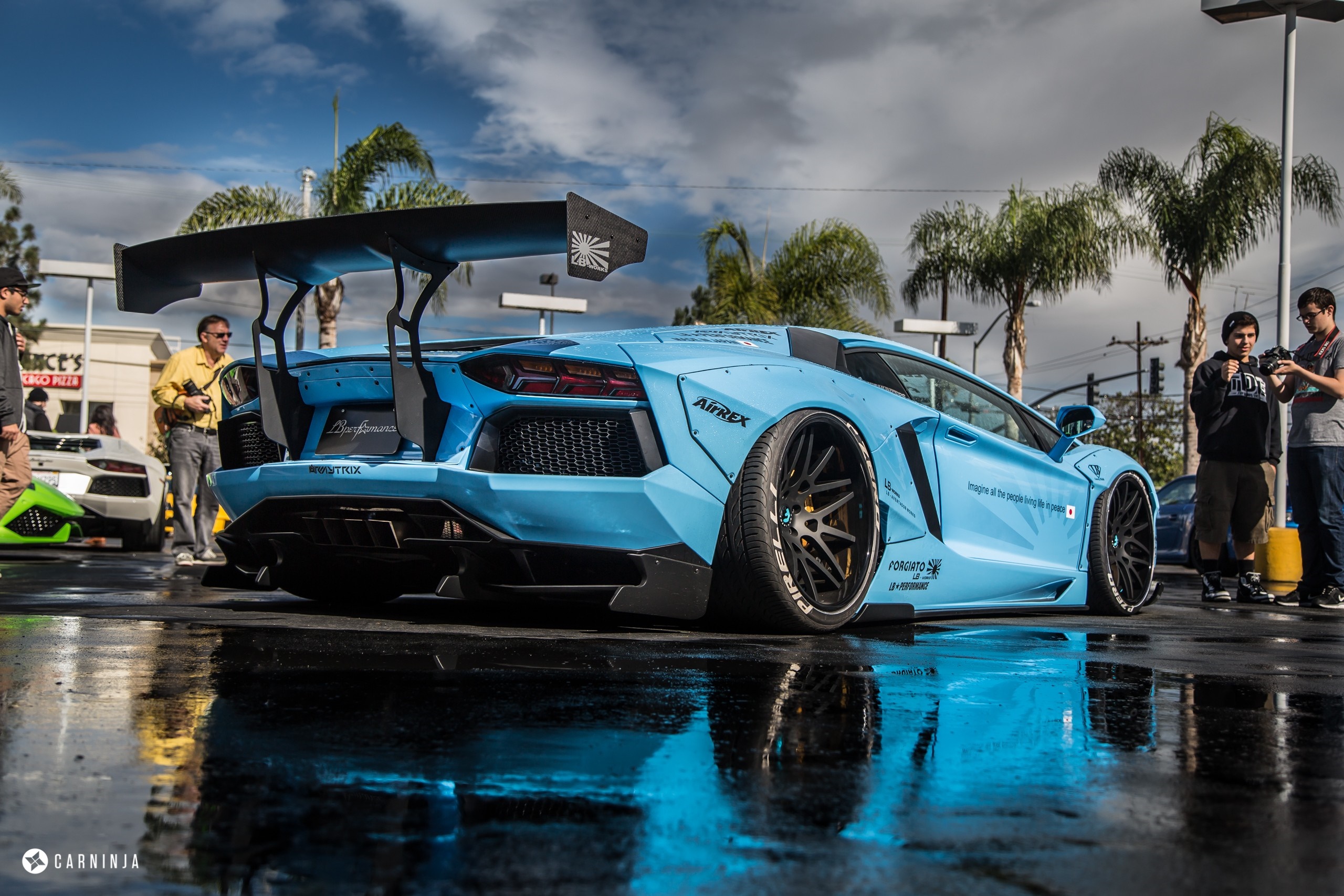 Teal Lamborghini Aventador SVJ with doors open HD Wallpaper