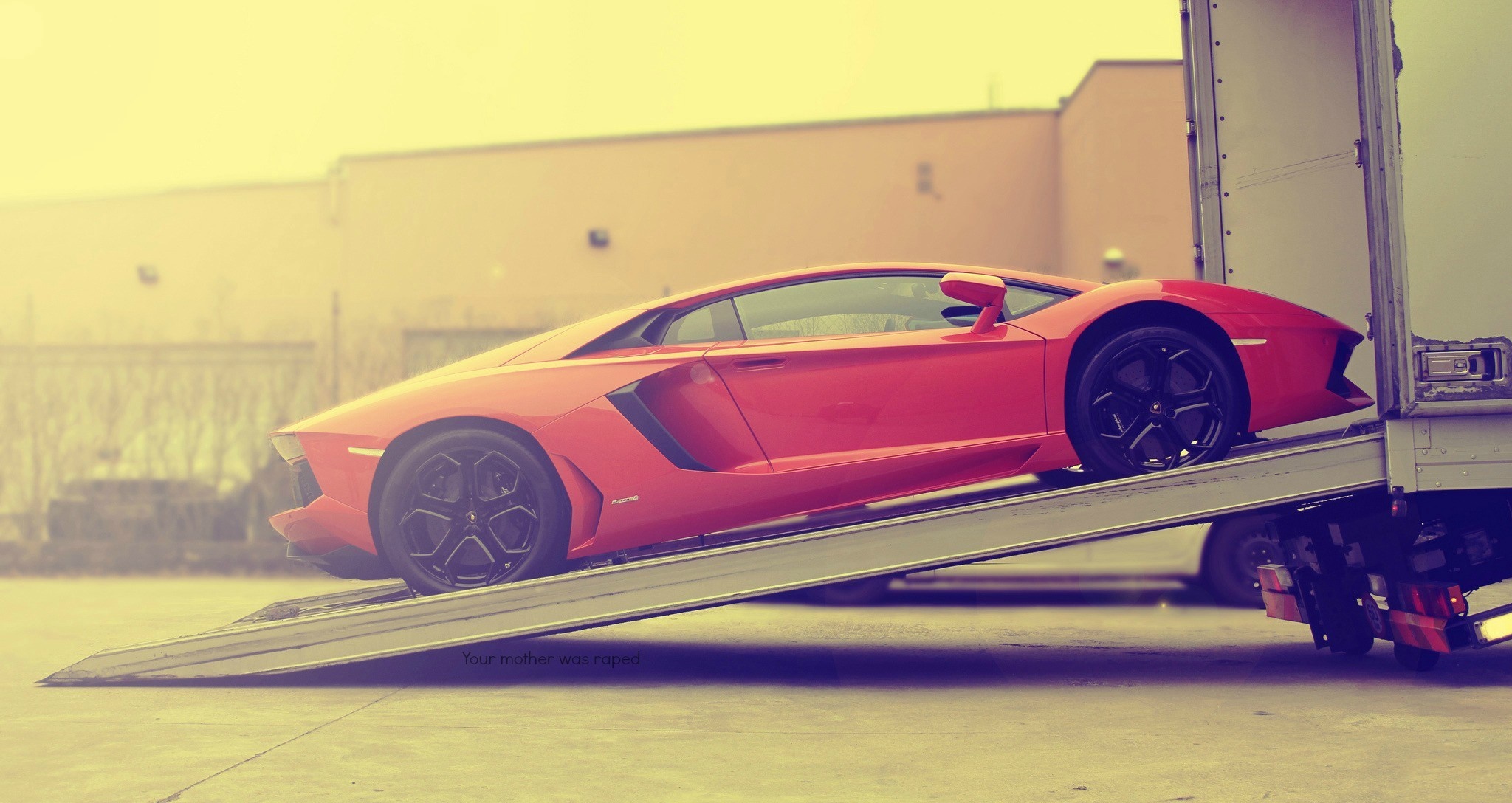 Red Lamborghini Aventador being loaded onto a truck HD Wallpaper