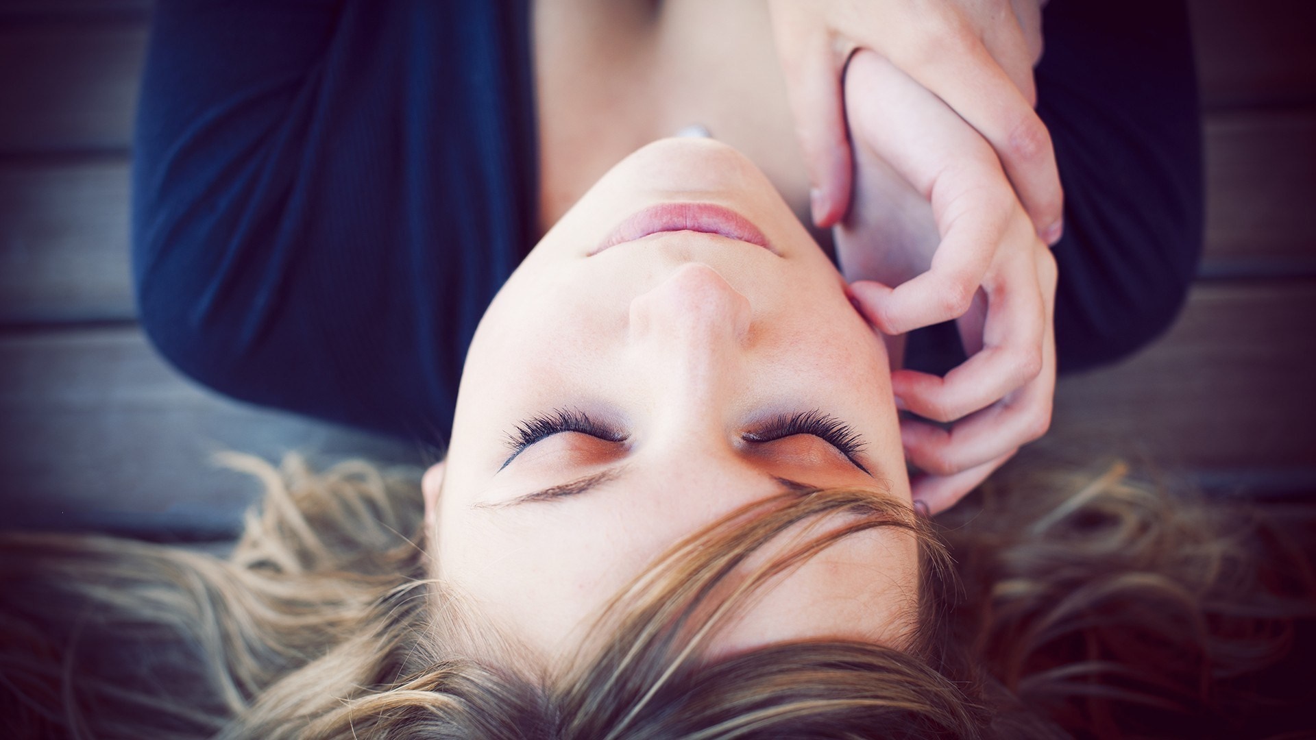 Woman lying on back with eyes closed HD Wallpaper