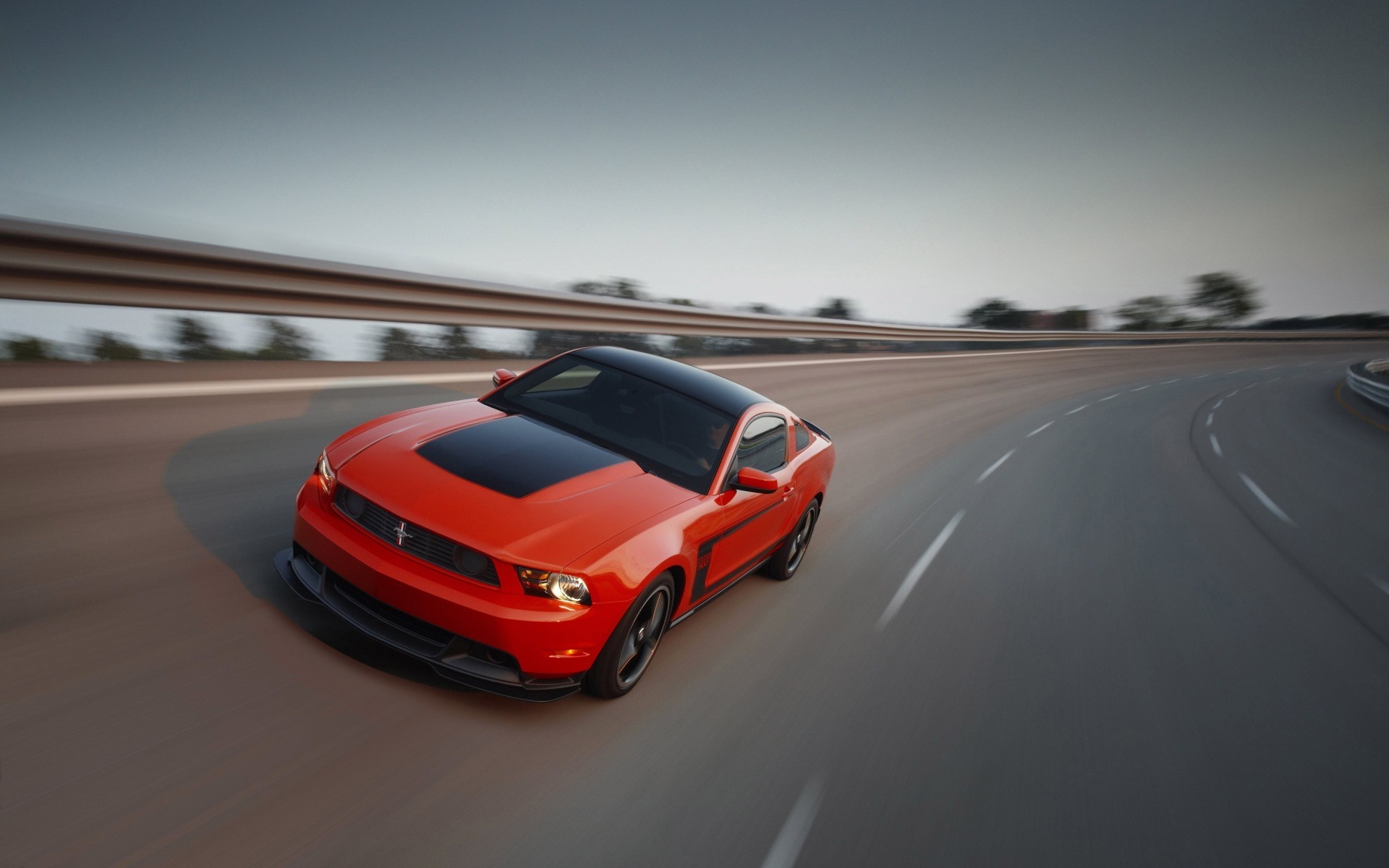 Red Ford Mustang Boss 302 on a curving road HD Wallpaper