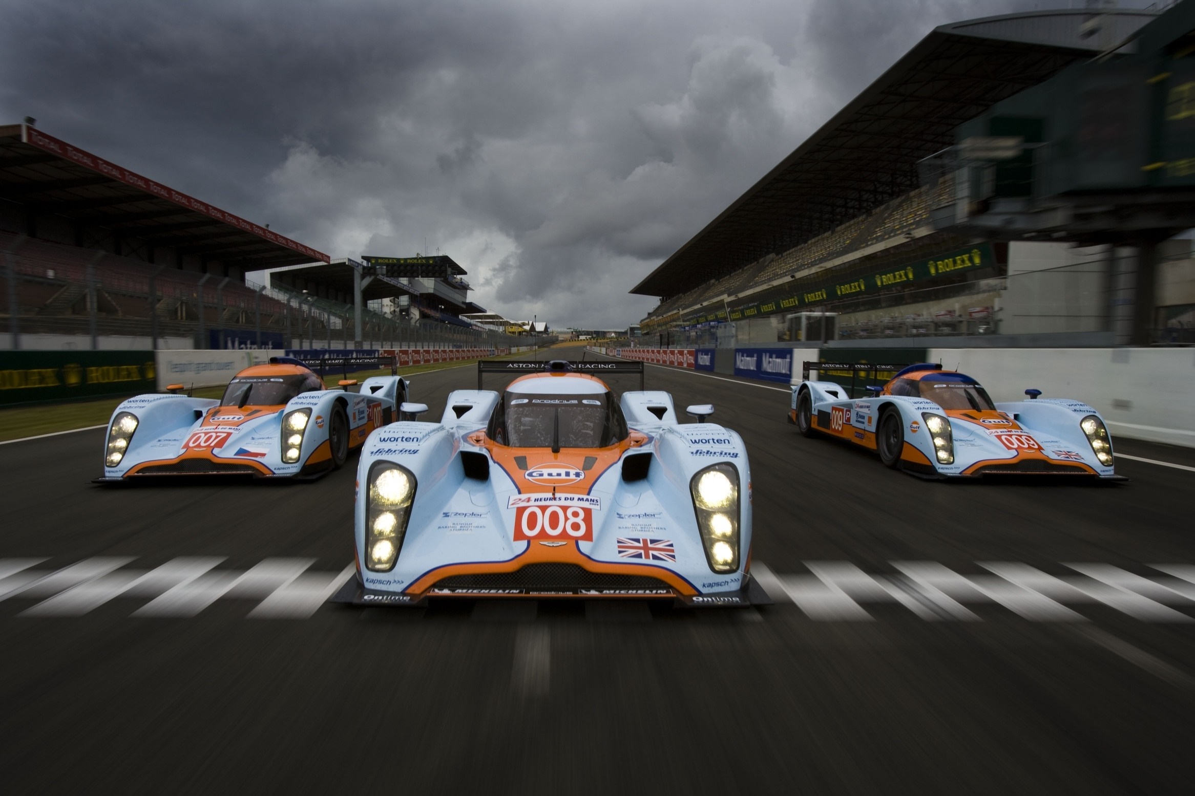 Aston Martin Racing Cars on Race Track HD Wallpaper
