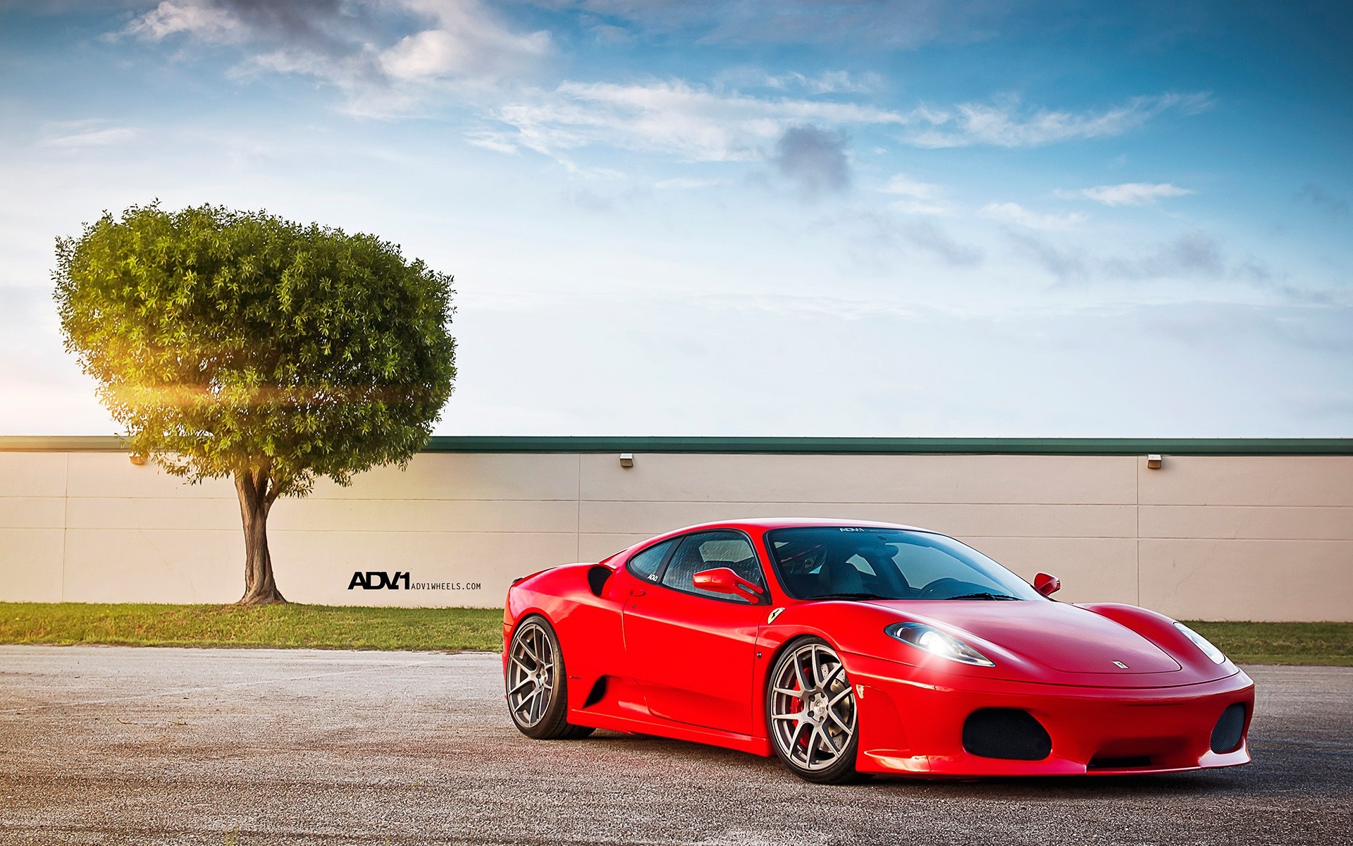 Red Ferrari F430 parked near a tree HD Wallpaper