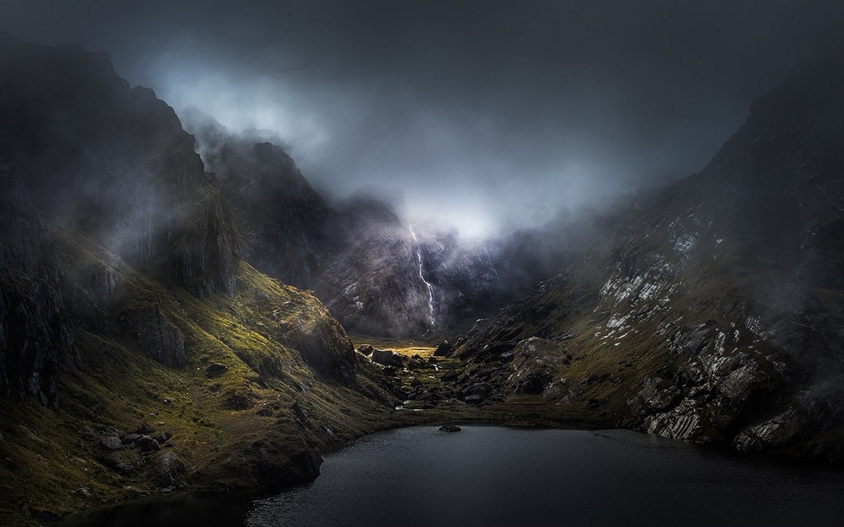 Misty mountain valley with a lake and waterfall HD Wallpaper