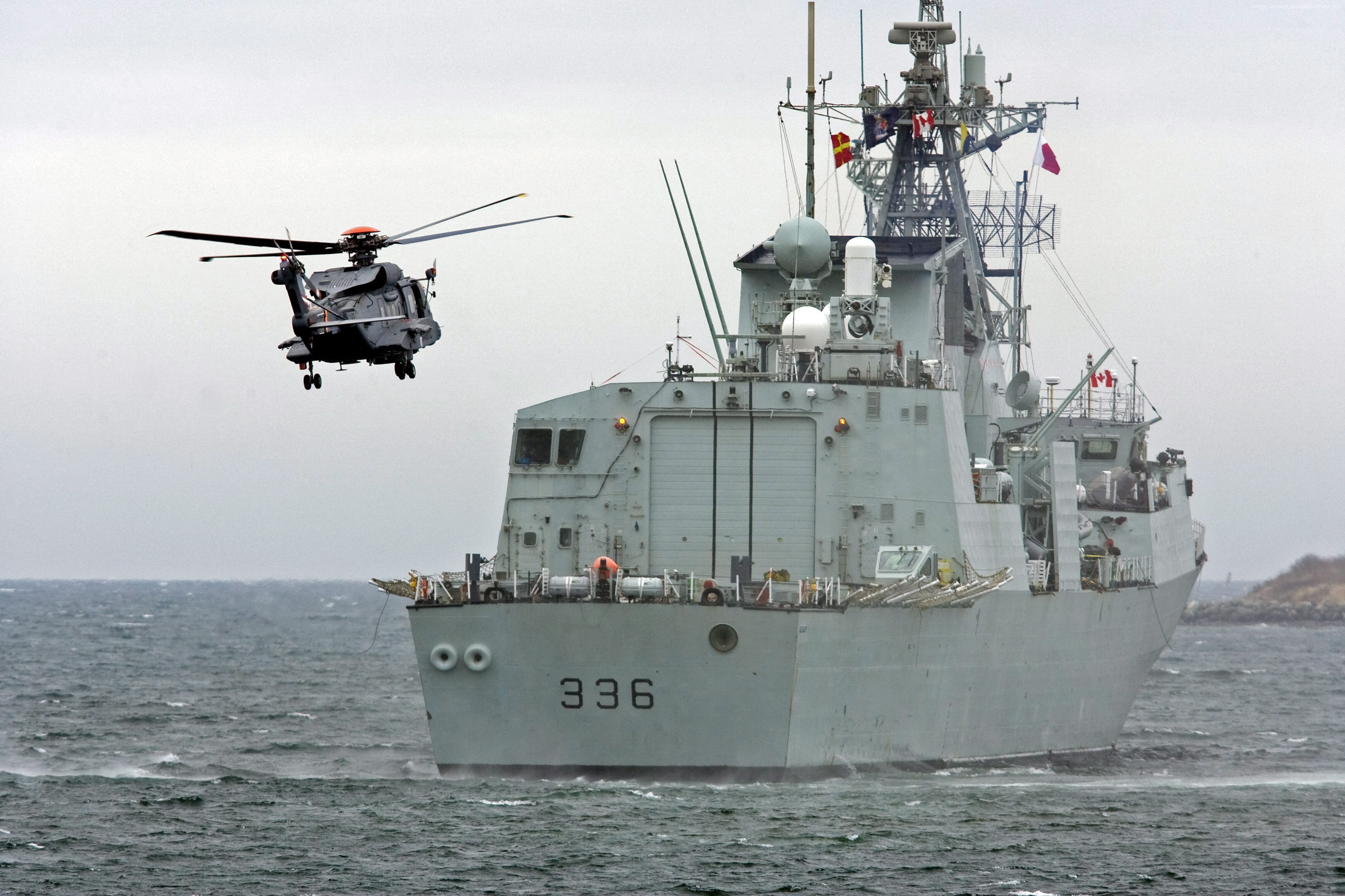 Sikorsky CH-148 Cyclone helicopter near Canadian Navy ship HD Wallpaper