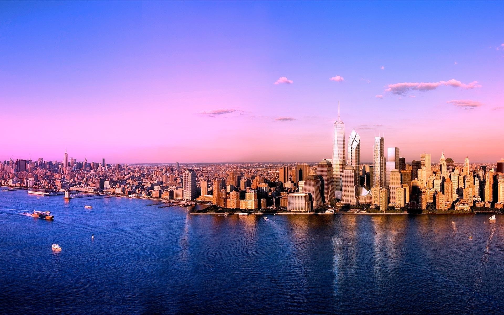 New York City skyline at sunset over the water HD Wallpaper