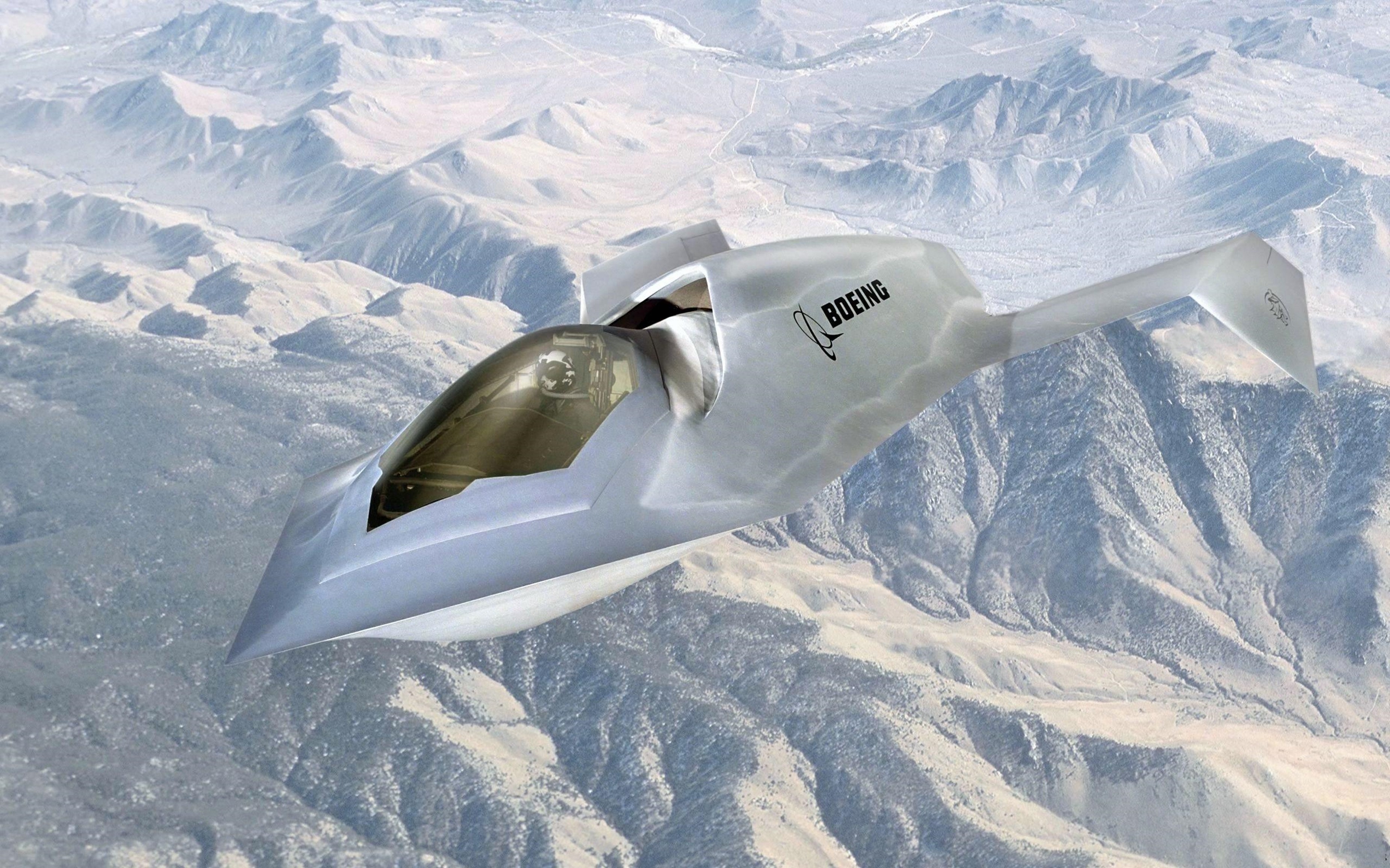 Boeing Bird of Prey stealth aircraft flying over mountains HD Wallpaper