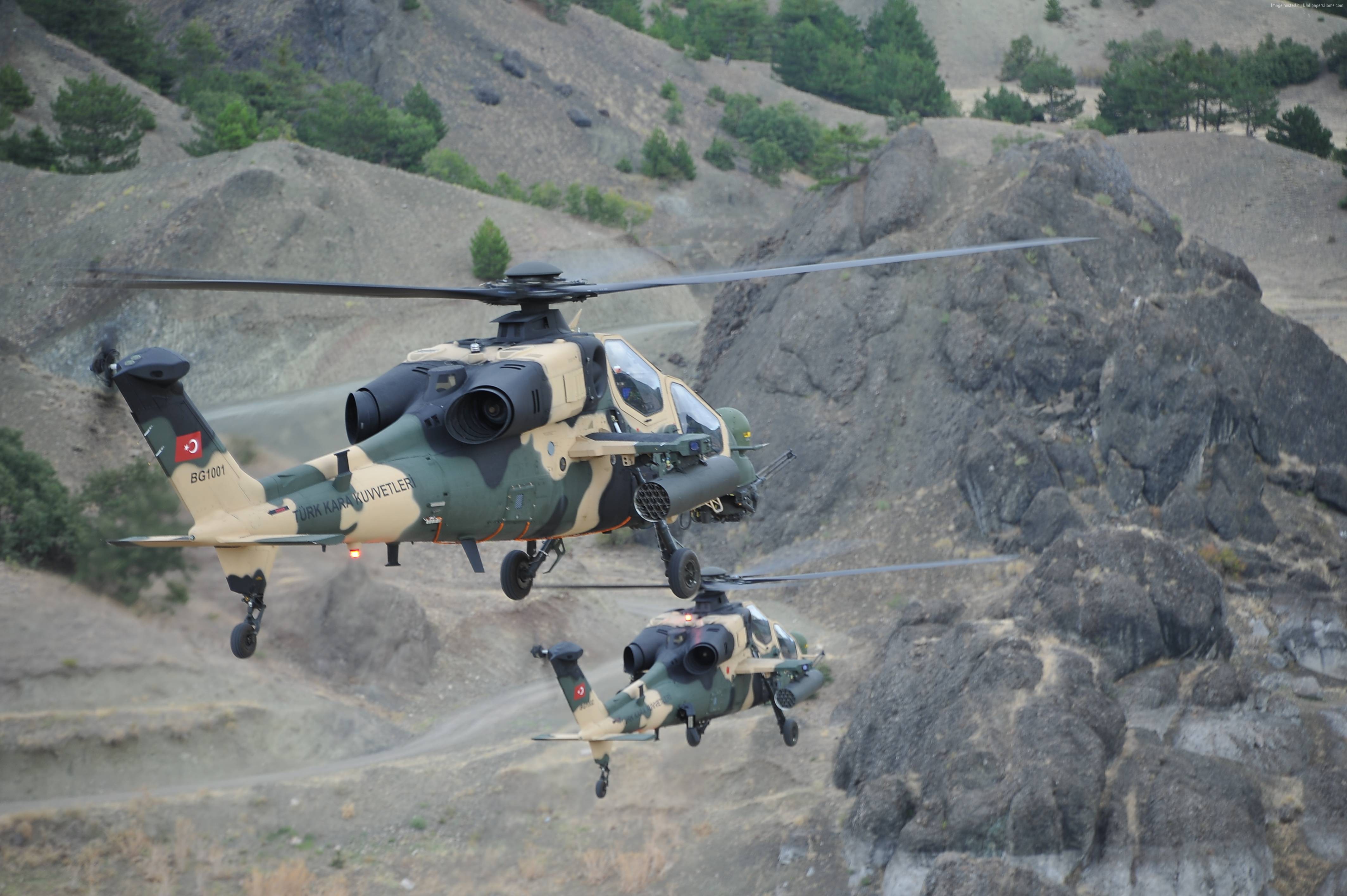 Two Turkish T-129 ATAK attack helicopters in flight HD Wallpaper