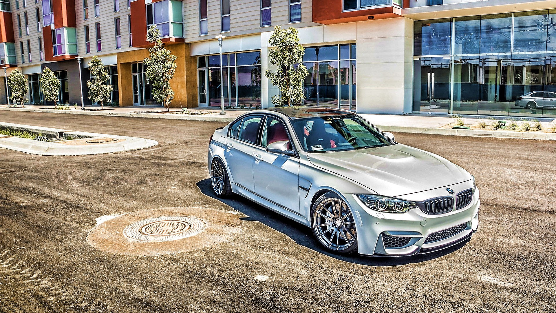 Silver BMW M3 Sedan parked on asphalt street HD Wallpaper
