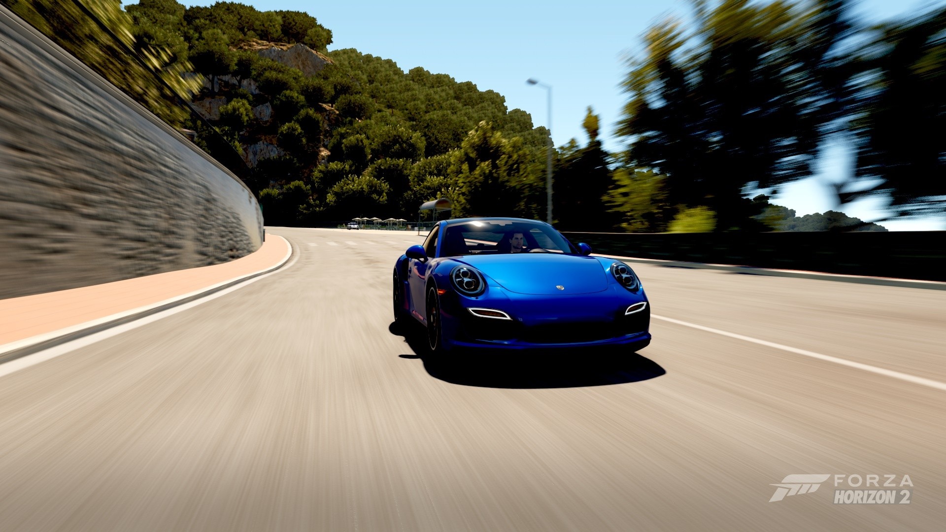Blue Porsche 911 Turbo driving on a road in Forza Horizon 2 HD Wallpaper