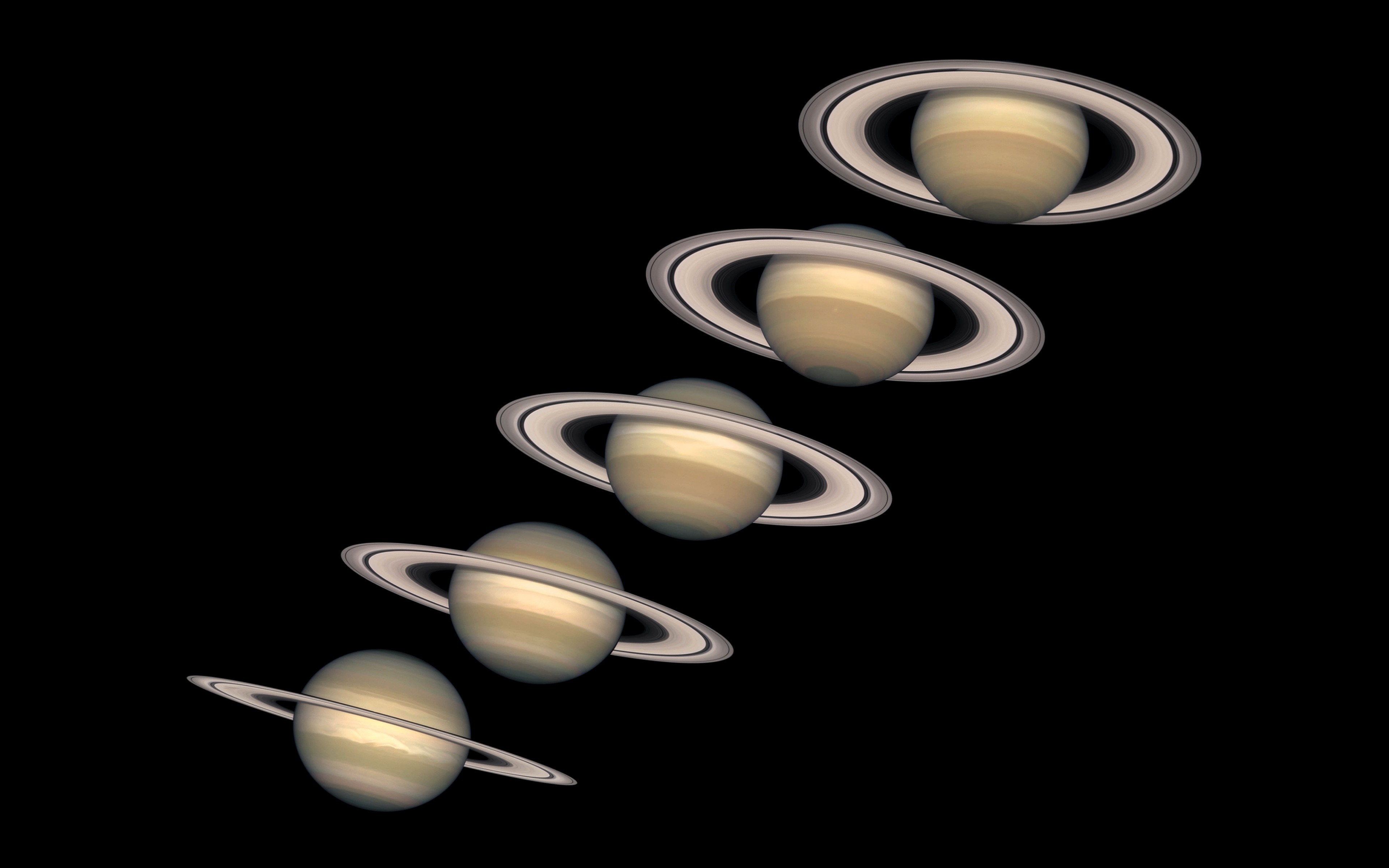 Saturn and its rings in space HD Wallpaper