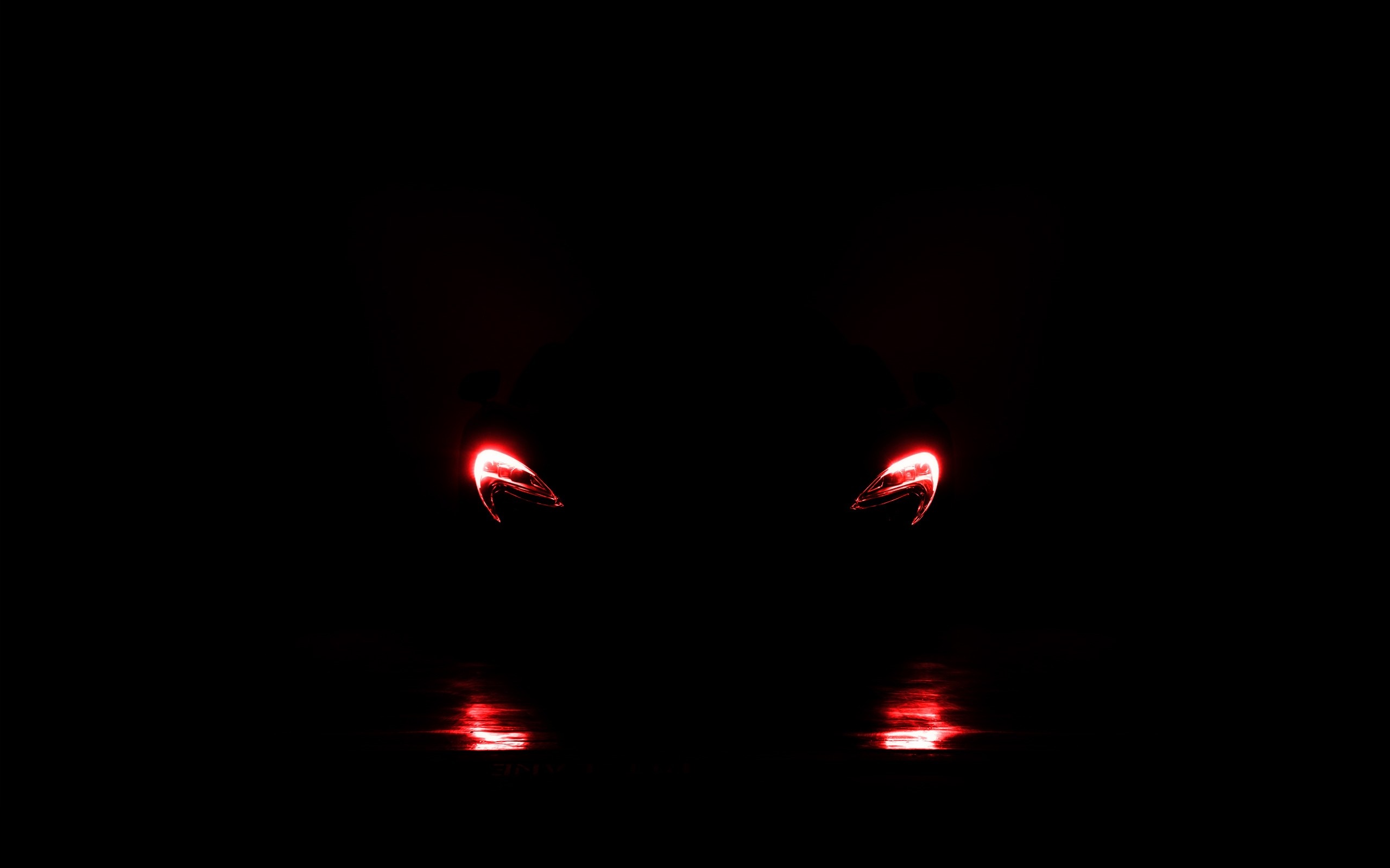 Red lights reflecting on a dark surface HD Wallpaper