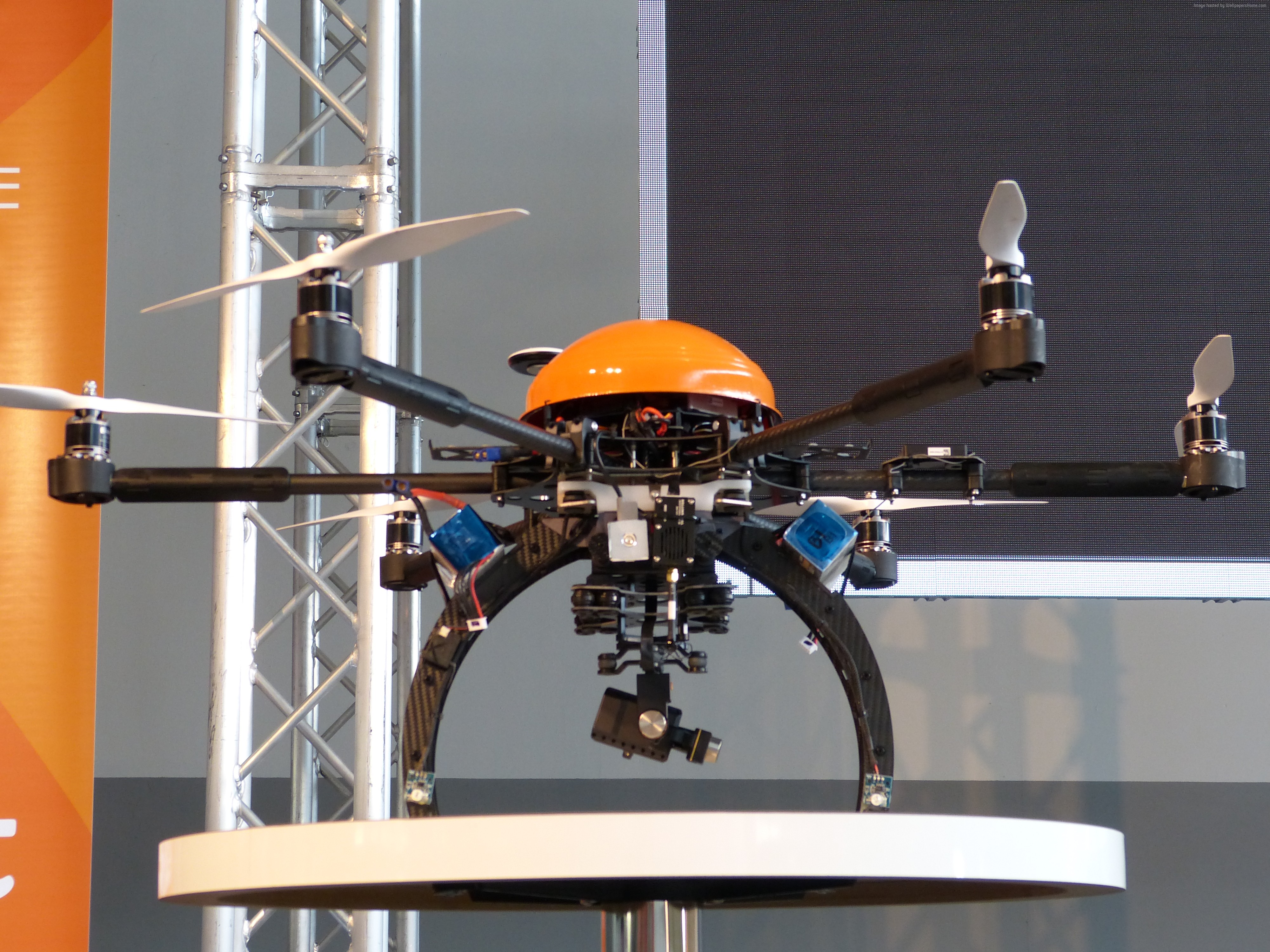 Orange and black drone with camera HD Wallpaper