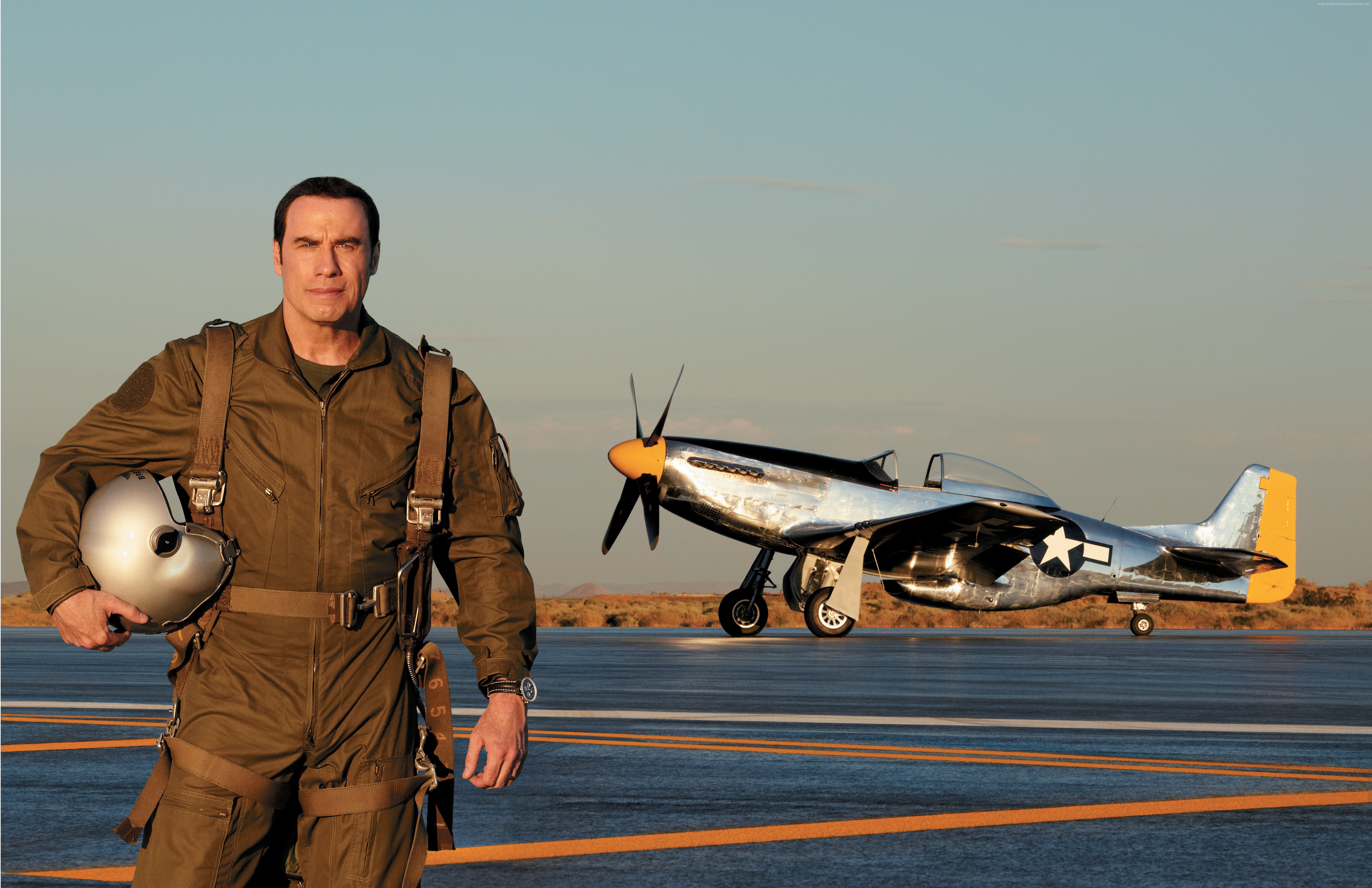 John Travolta in a pilot uniform with a P-51 Mustang airplane HD Wallpaper