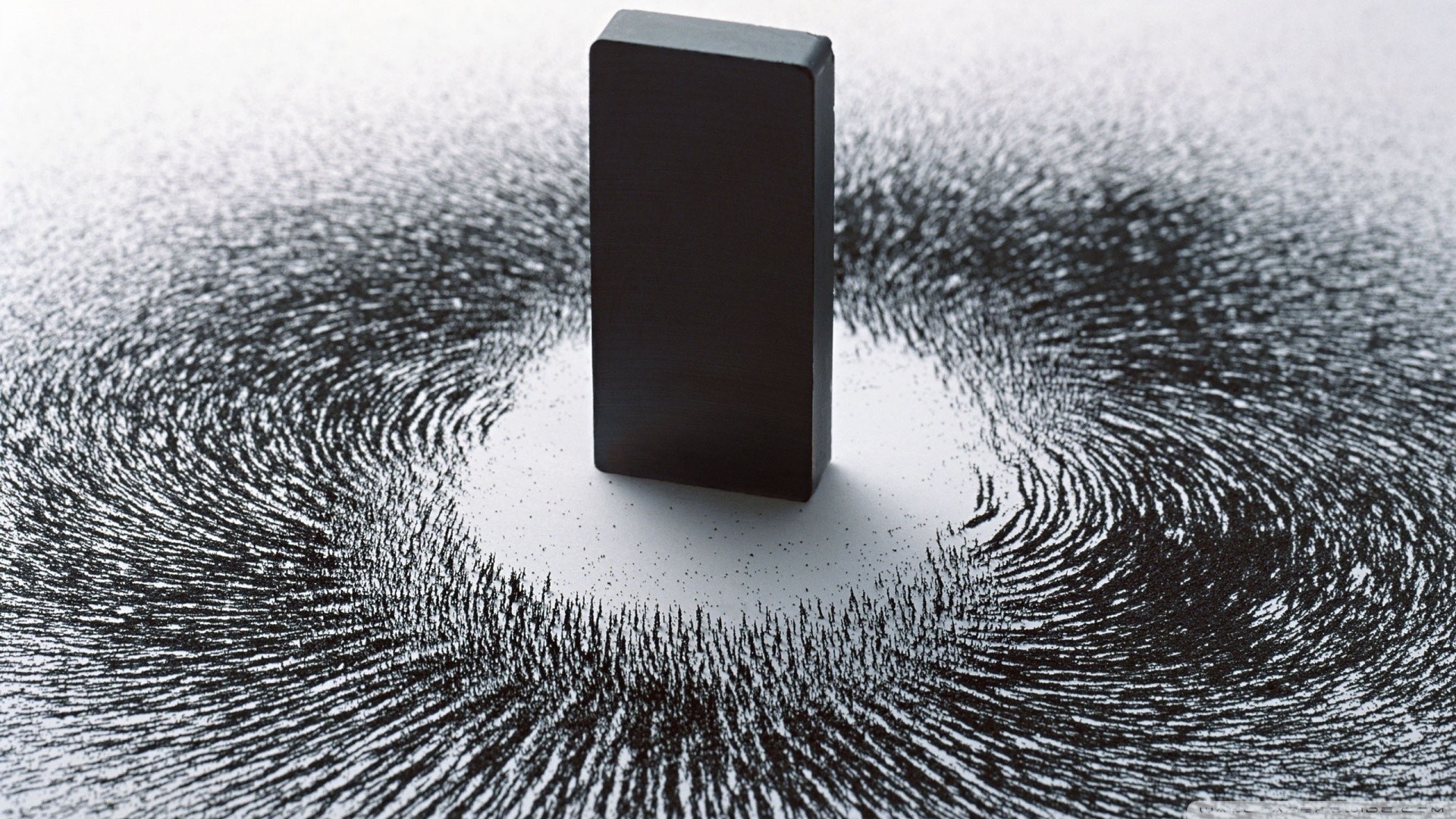 Magnet and iron filings showing magnetic field HD Wallpaper