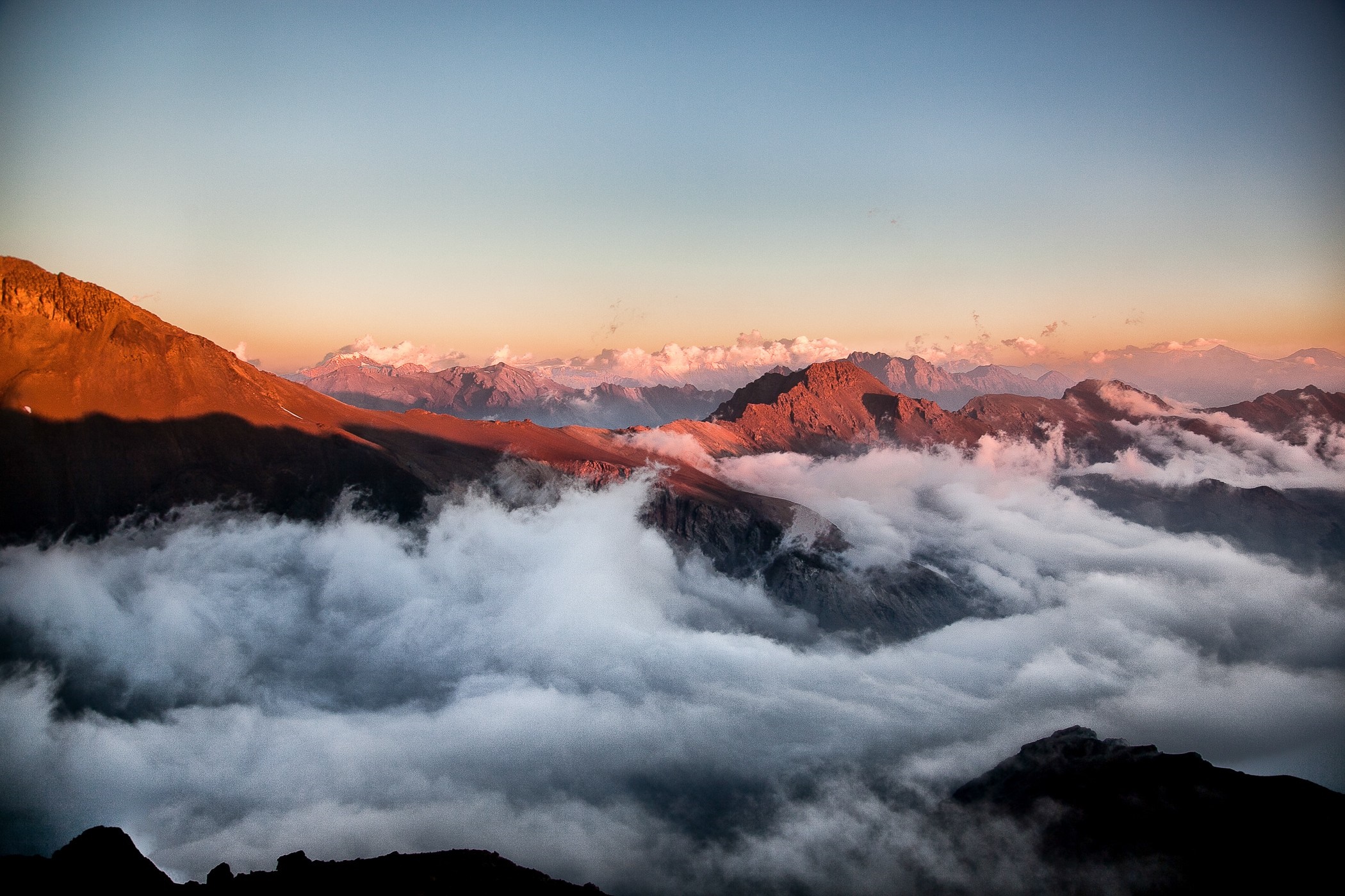 Mountains at sunset with clouds HD Wallpaper