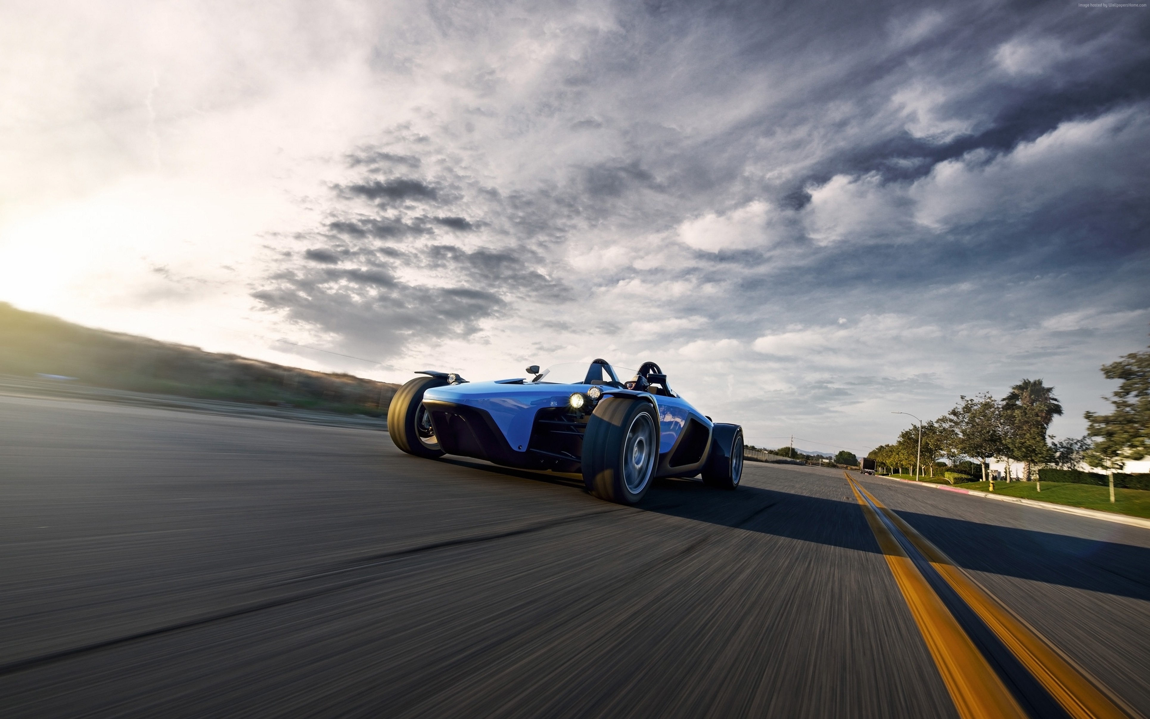 Blue Sector111 Drakan Spyder racing on a road HD Wallpaper