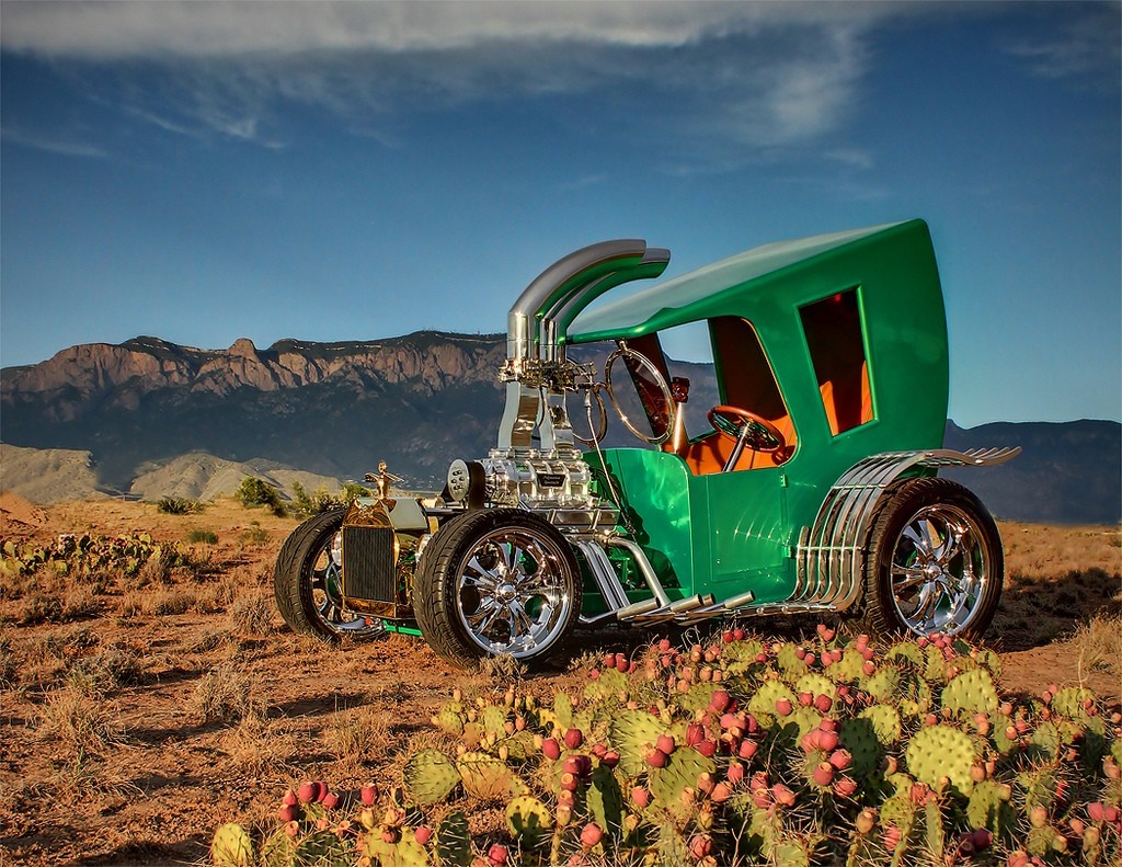 Custom green hot rod car in desert landscape HD Wallpaper