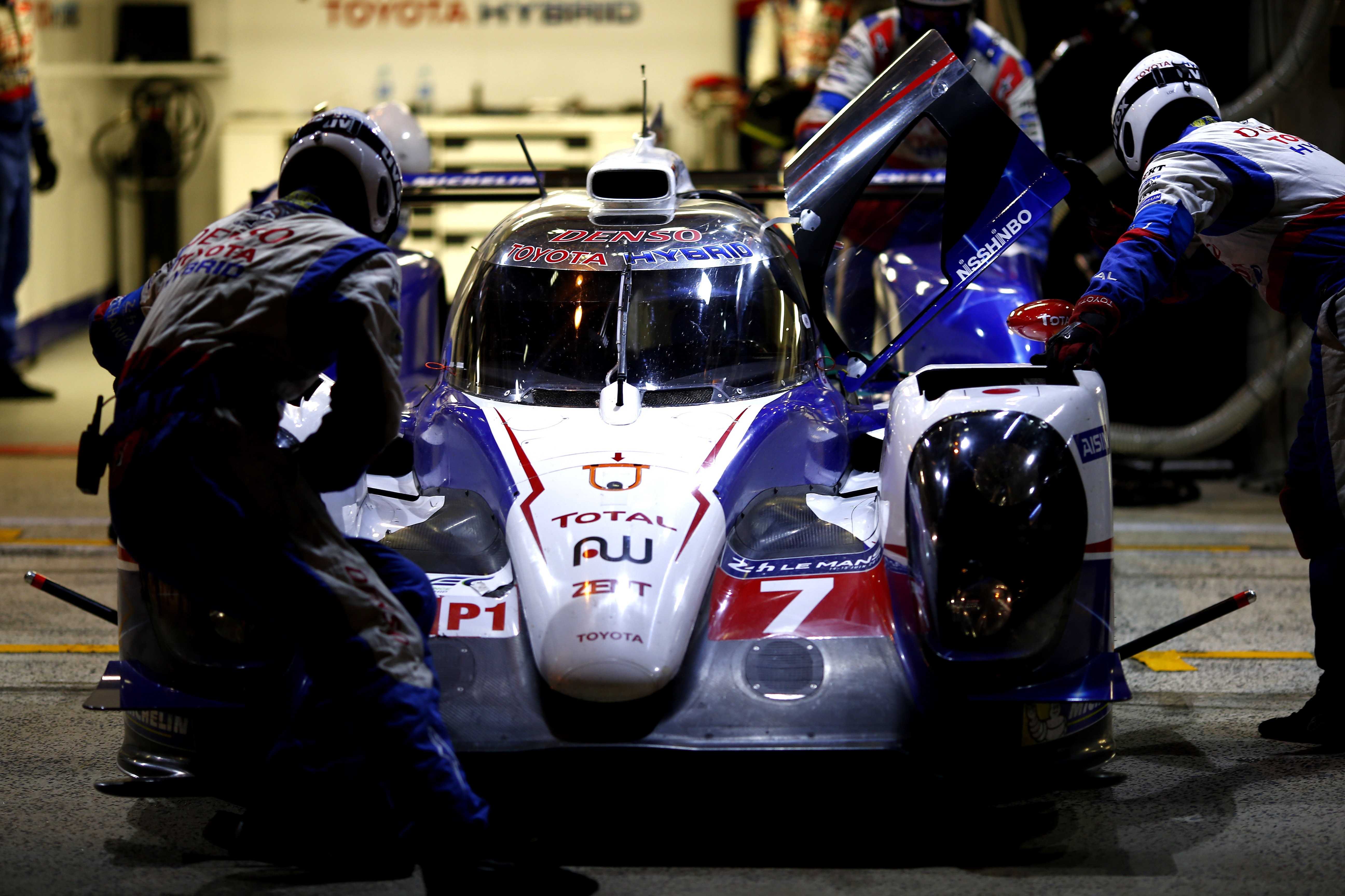 Toyota TS040 Hybrid race car in pit stop HD Wallpaper