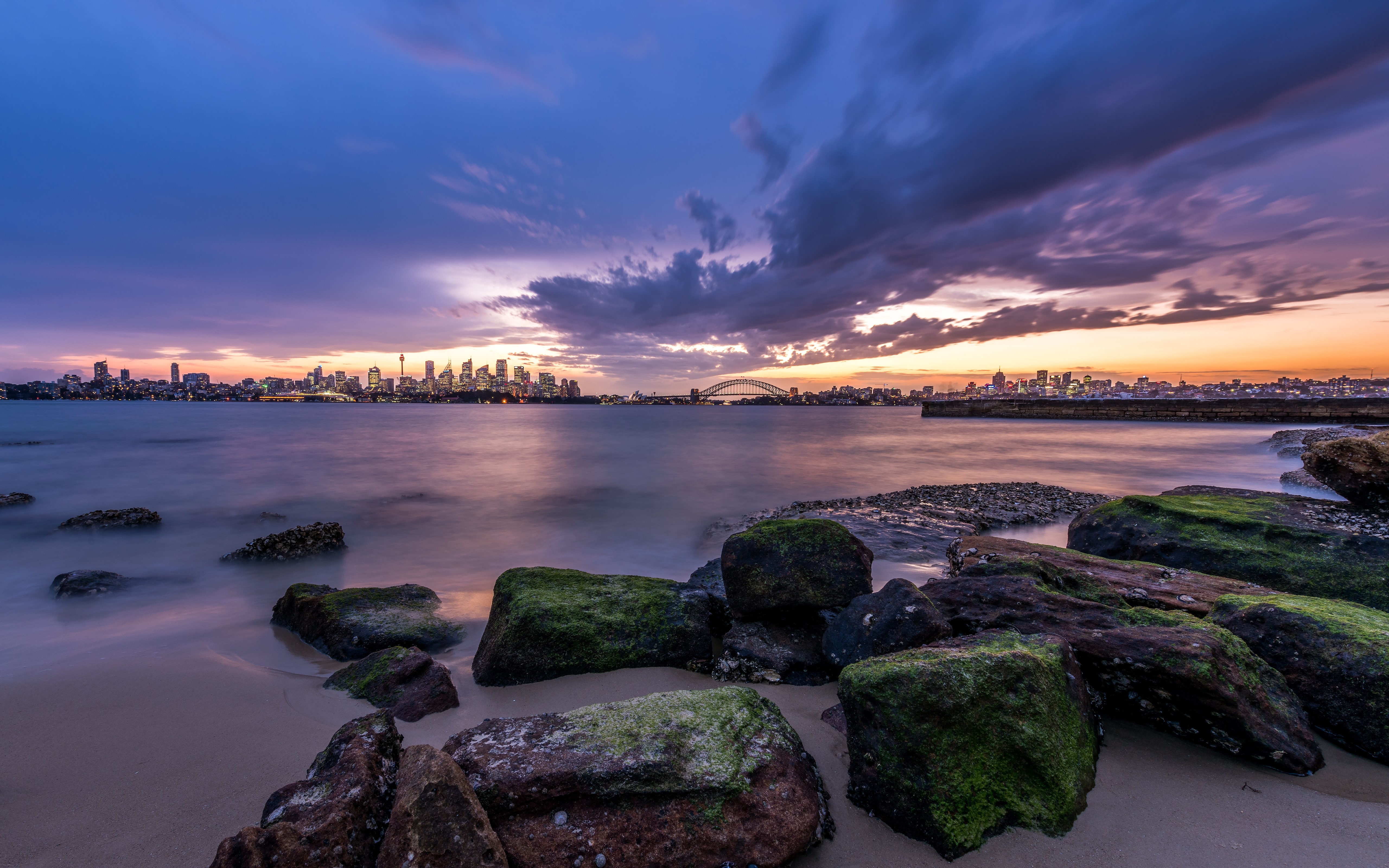 Sydney skyline at sunset with harbor bridge and rocks HD Wallpaper