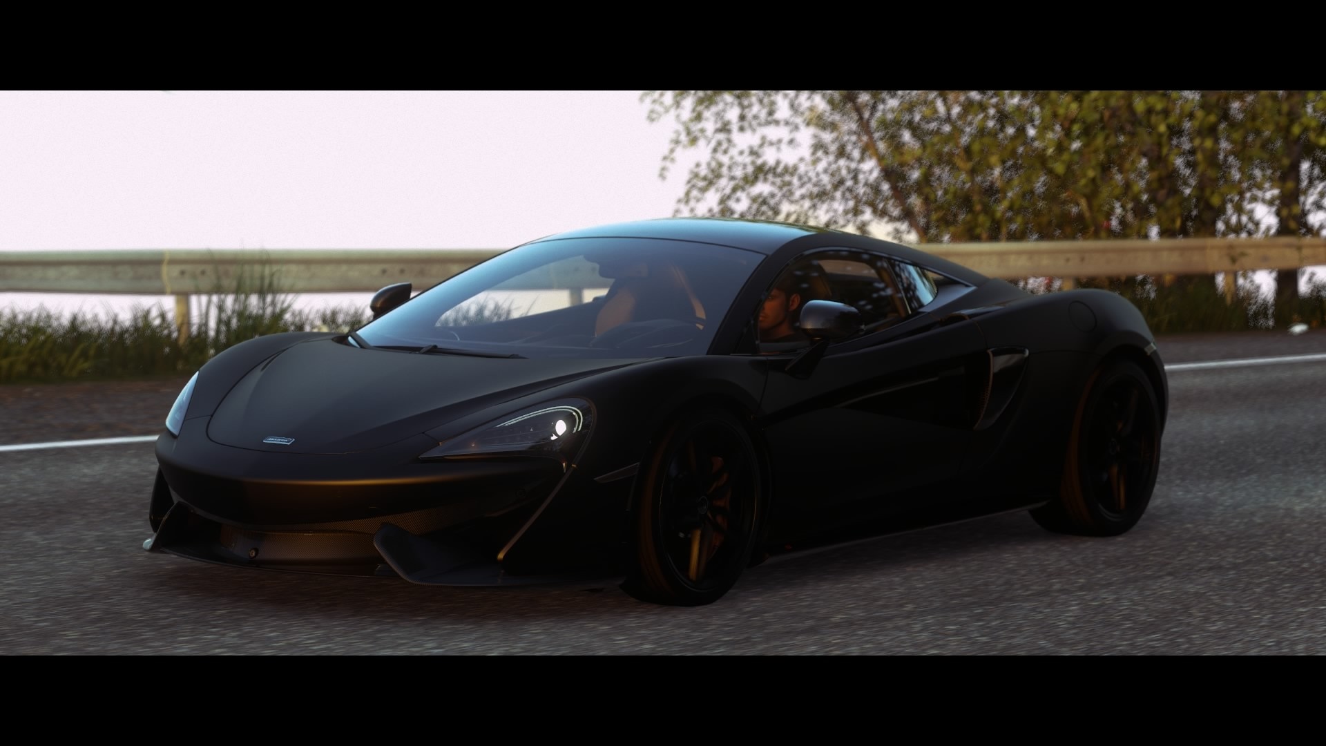 Black McLaren MP4 12C sports car on a road HD Wallpaper