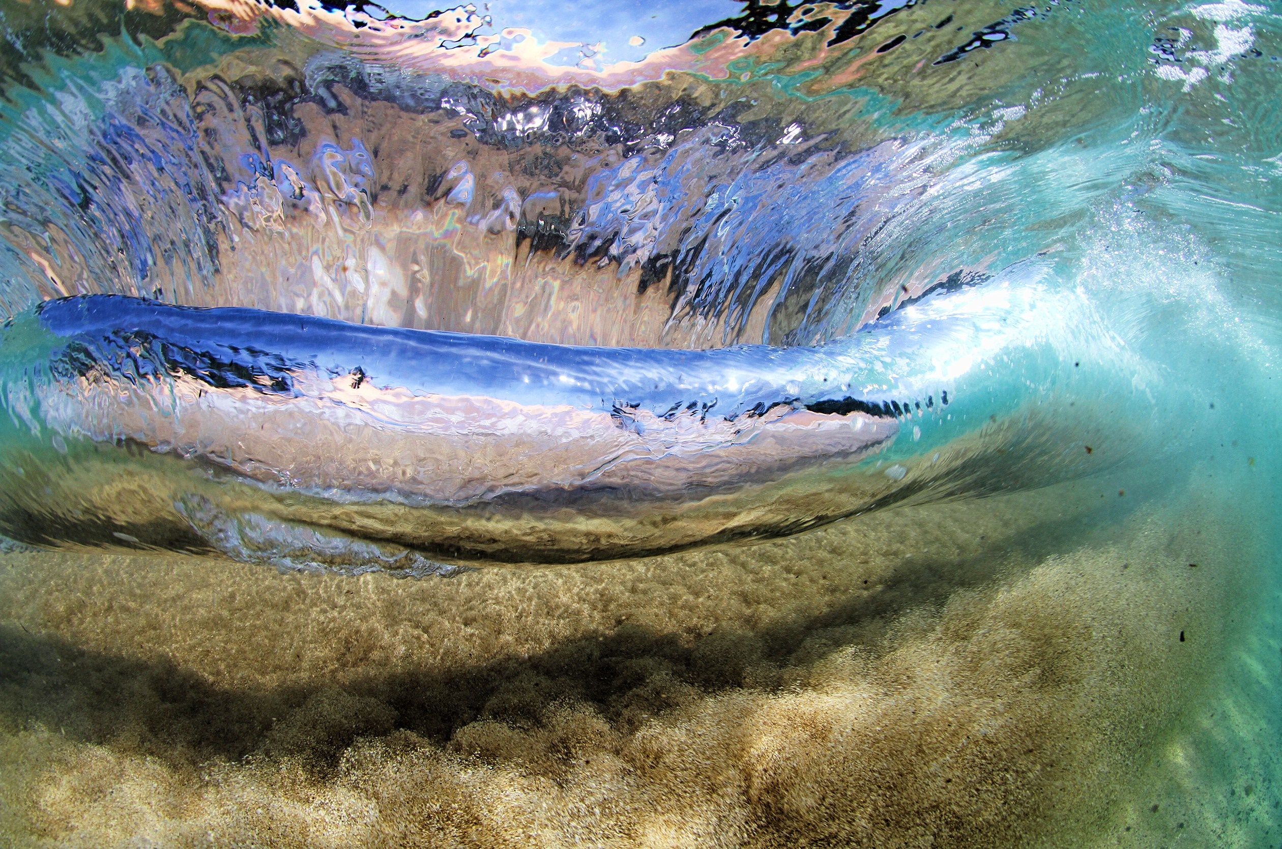 Underwater view of a breaking ocean wave HD Wallpaper