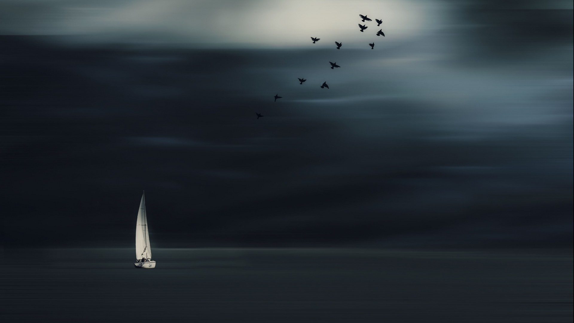 Sailboat and birds in a dark, atmospheric seascape HD Wallpaper