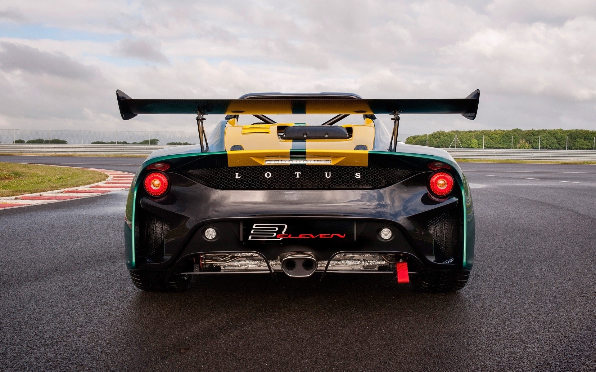 Lotus 3-Eleven race car on a wet track HD Wallpaper