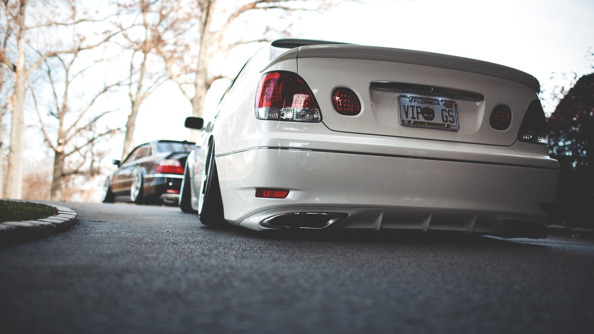 White Lexus GS with custom license plate parked on asphalt HD Wallpaper
