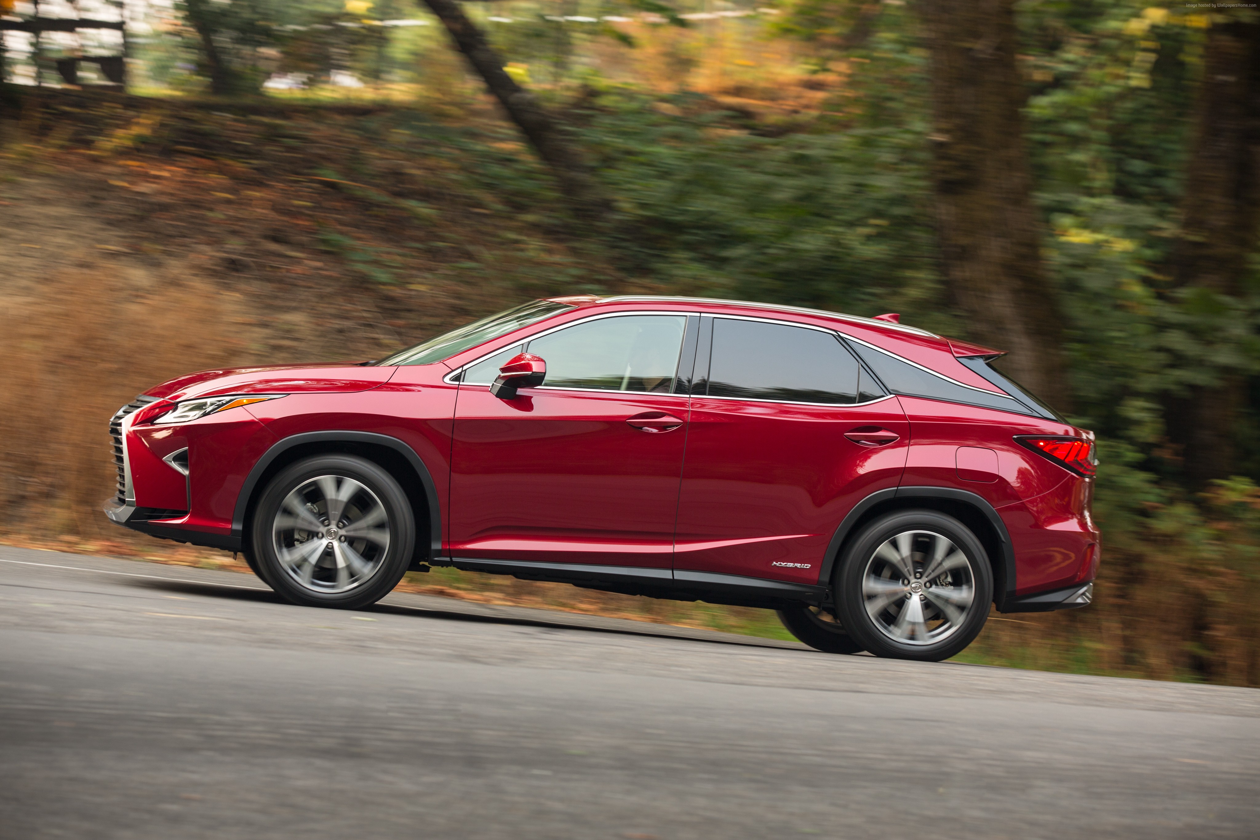 Red Lexus RX 450 Hybrid driving on a road HD Wallpaper