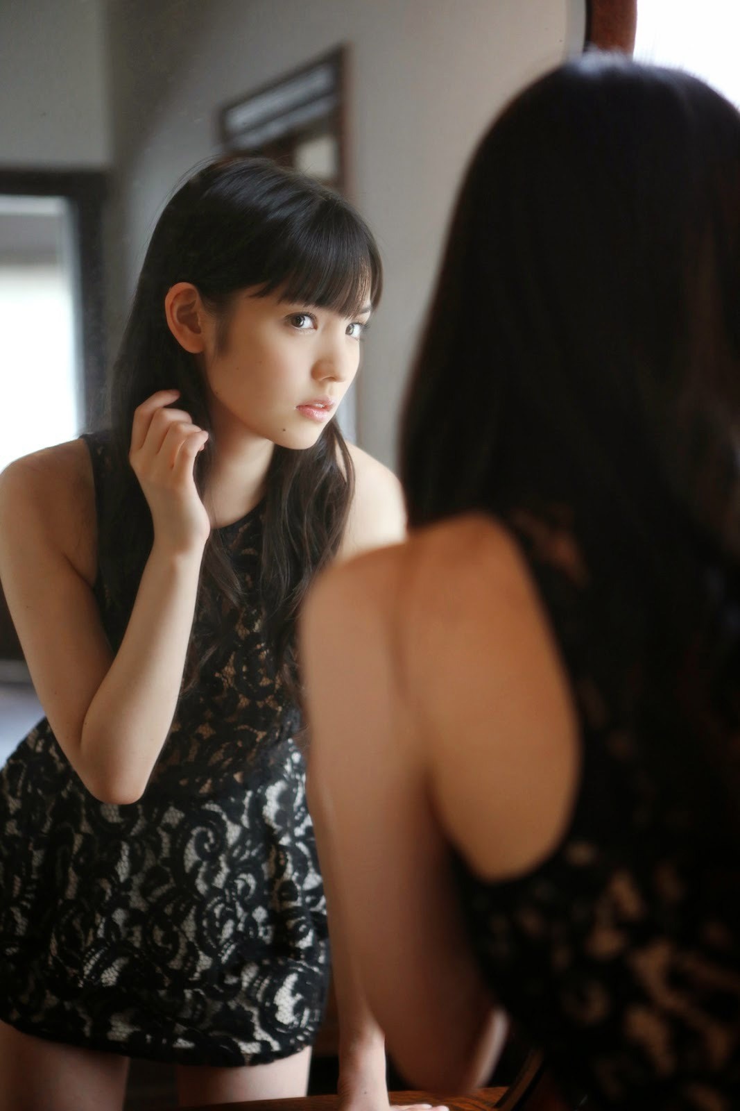 Woman in black lace dress looking in mirror HD Wallpaper