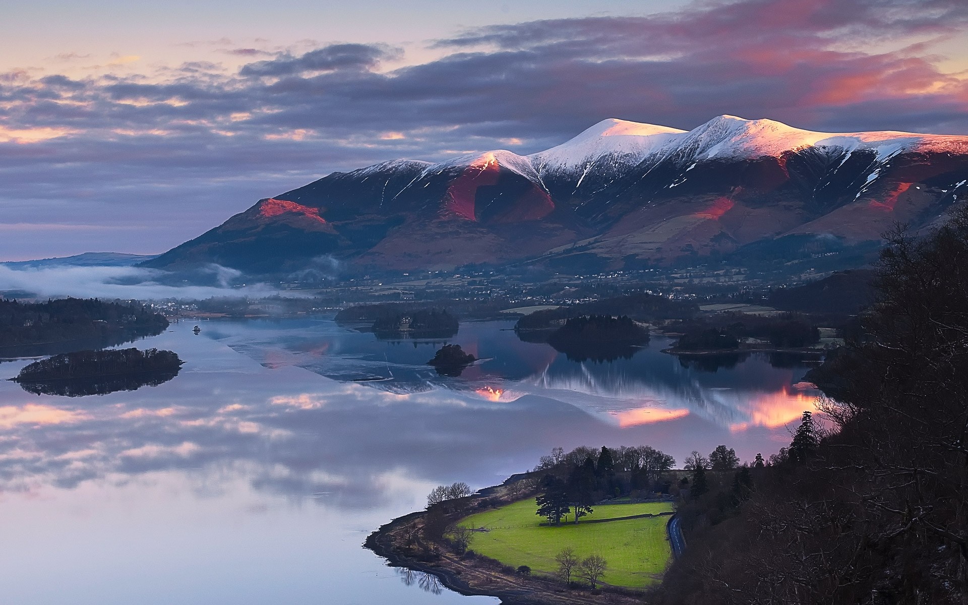 Snowy mountains reflecting in a lake at sunset HD Wallpaper