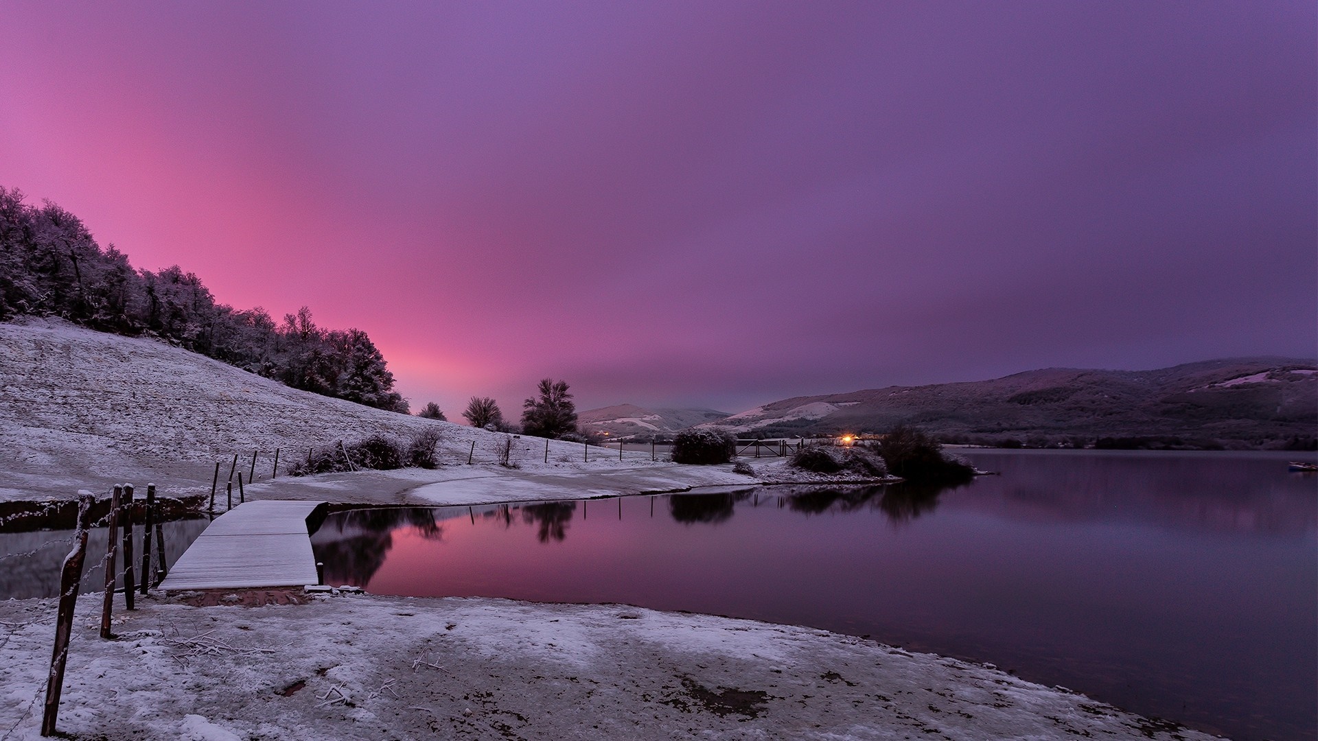 Snowy landscape with lake and purple sunset sky HD Wallpaper