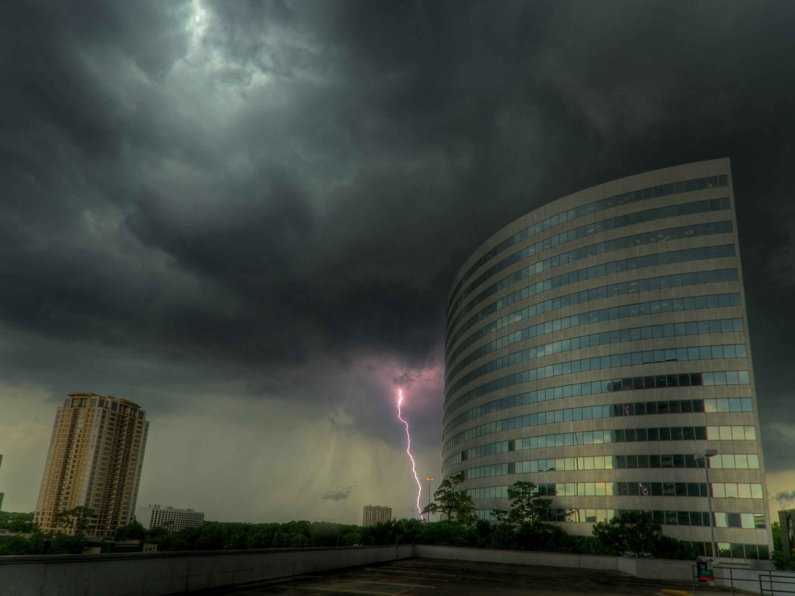 Cityscape with lightning strike during a storm HD Wallpaper