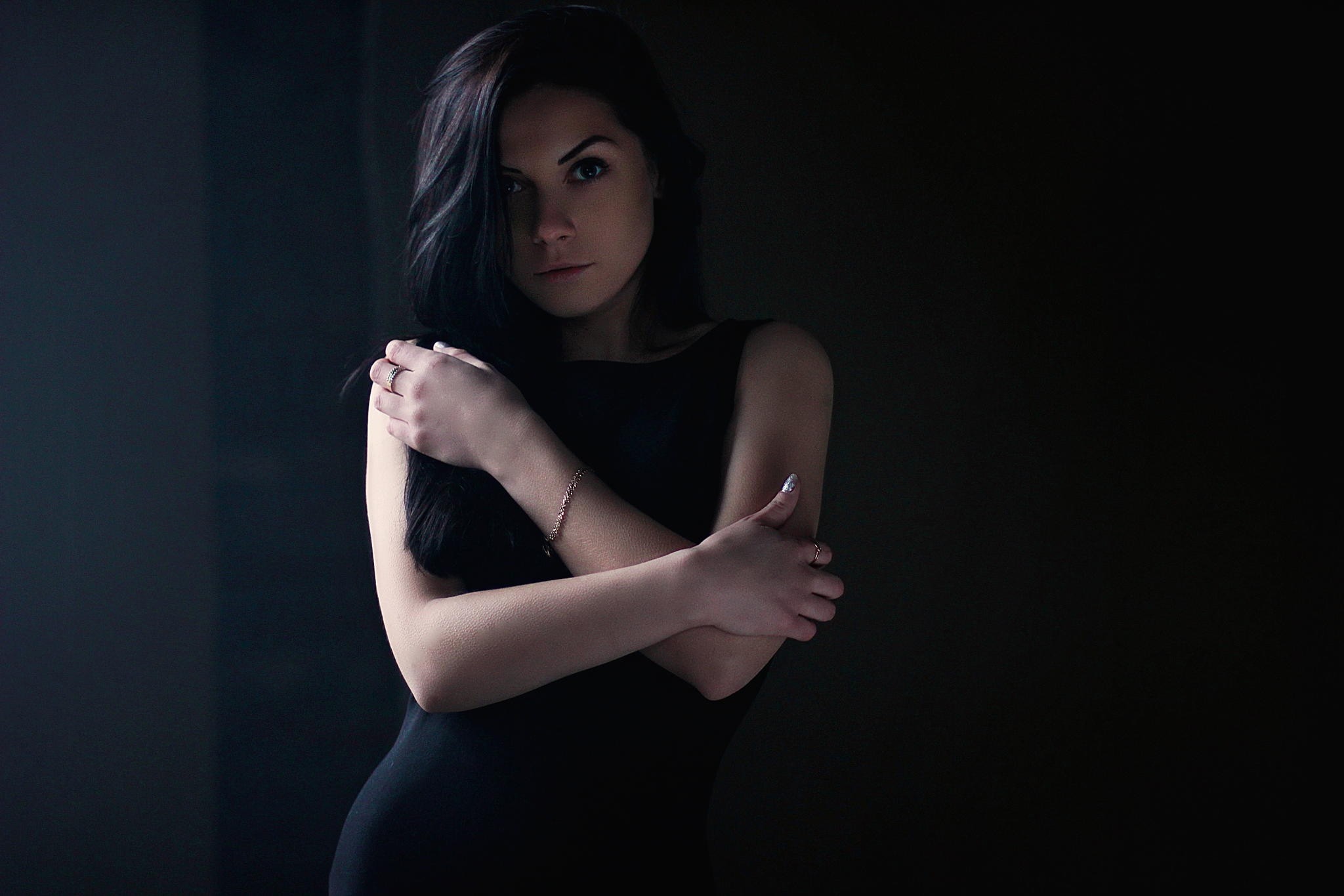 Woman with dark hair in a black dress HD Wallpaper