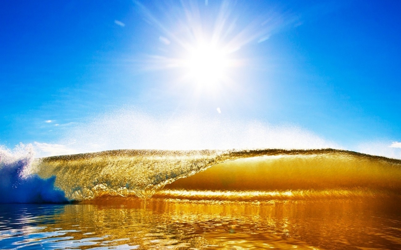 Golden wave under bright sun and blue sky HD Wallpaper