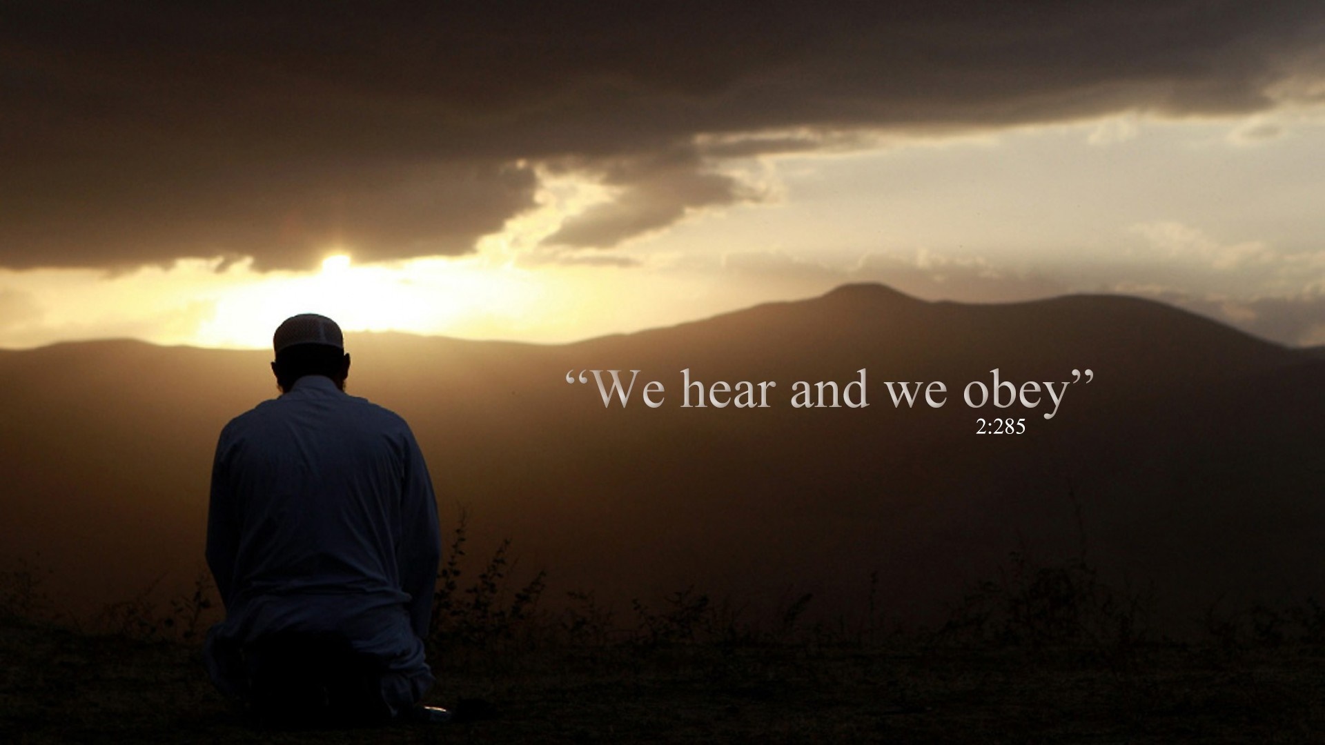 Man praying at sunset with Quran verse HD Wallpaper