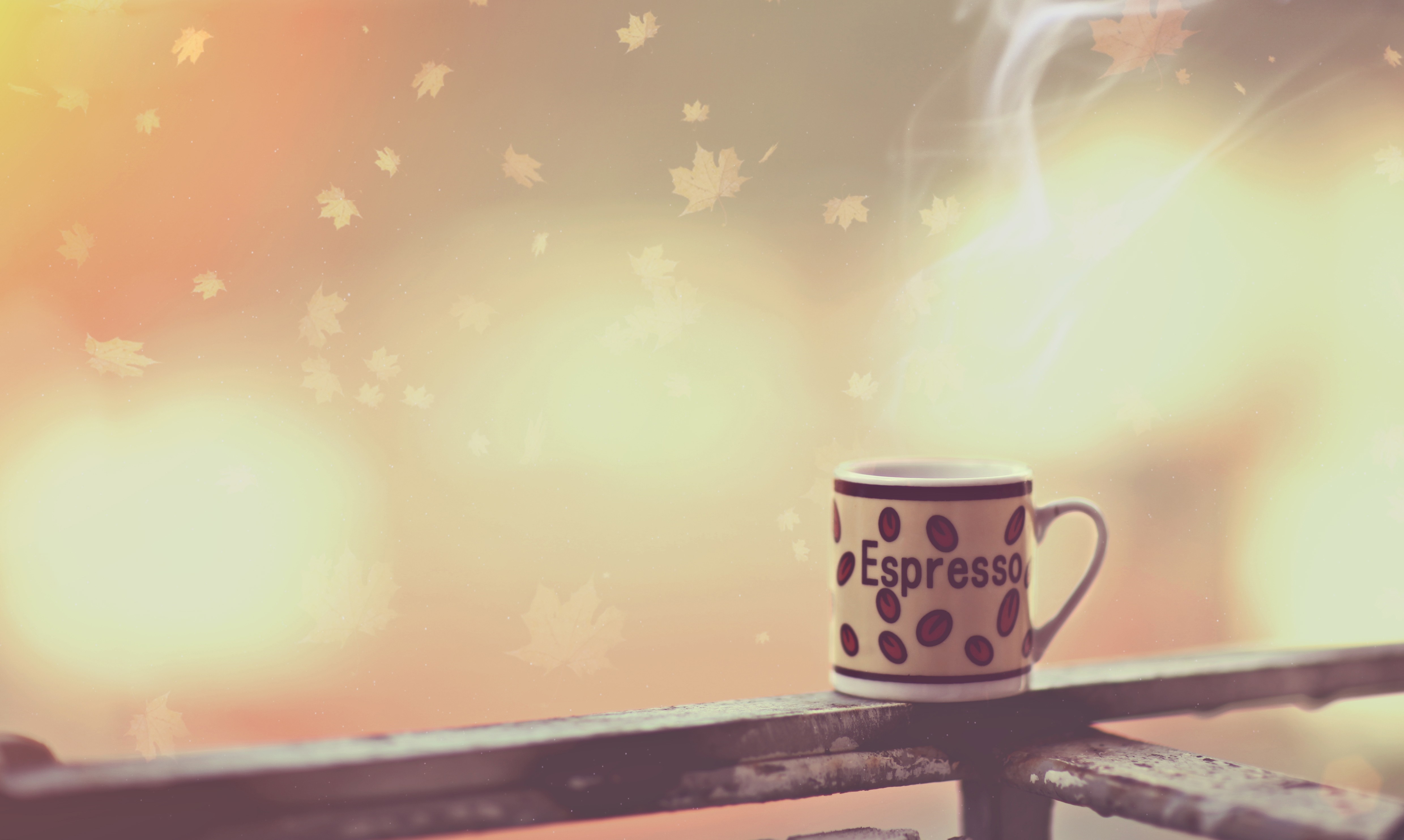 Espresso cup with steam and falling leaves HD Wallpaper