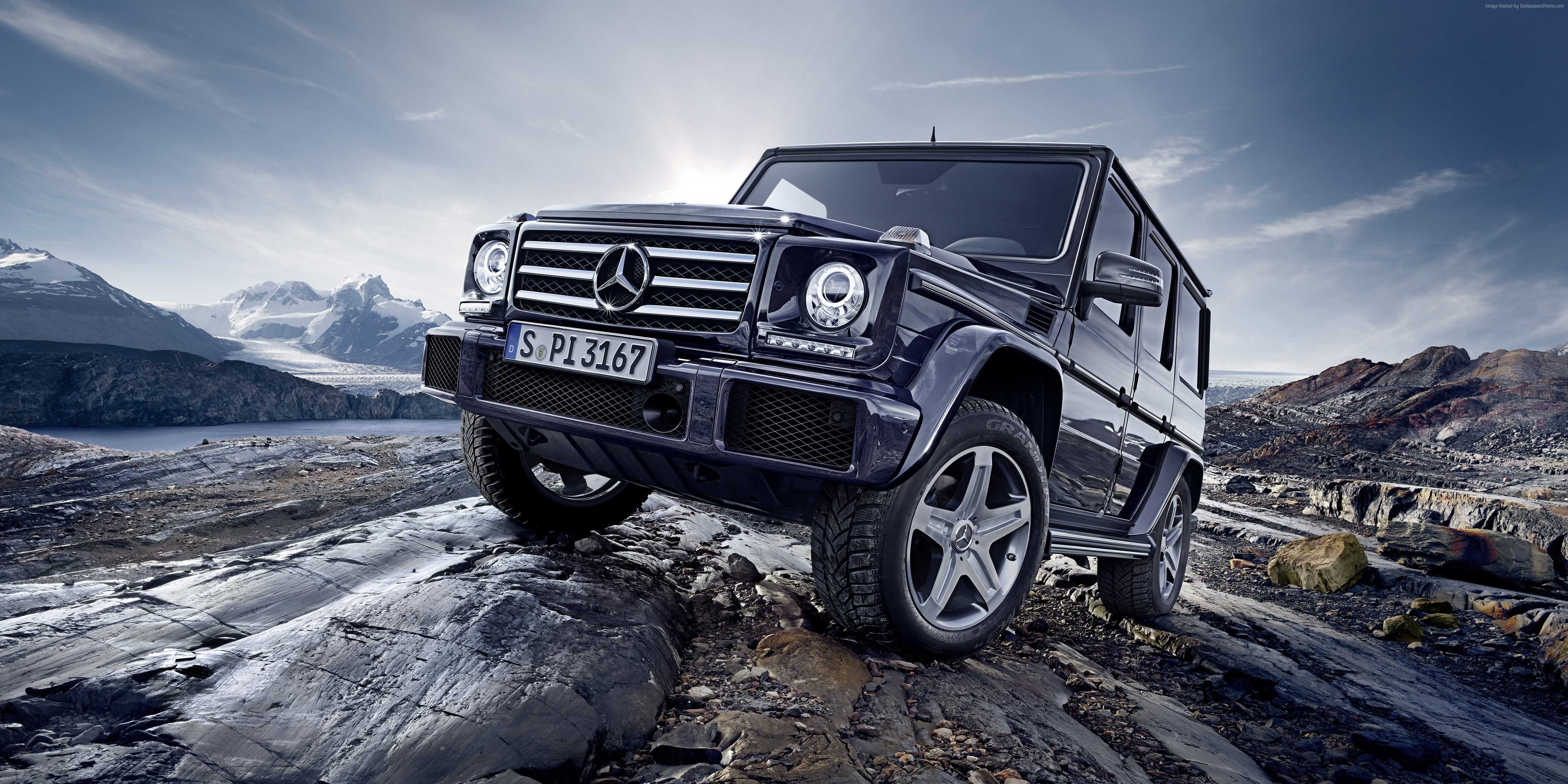 Mercedes-Benz G-Class SUV off-roading on rocky terrain HD Wallpaper