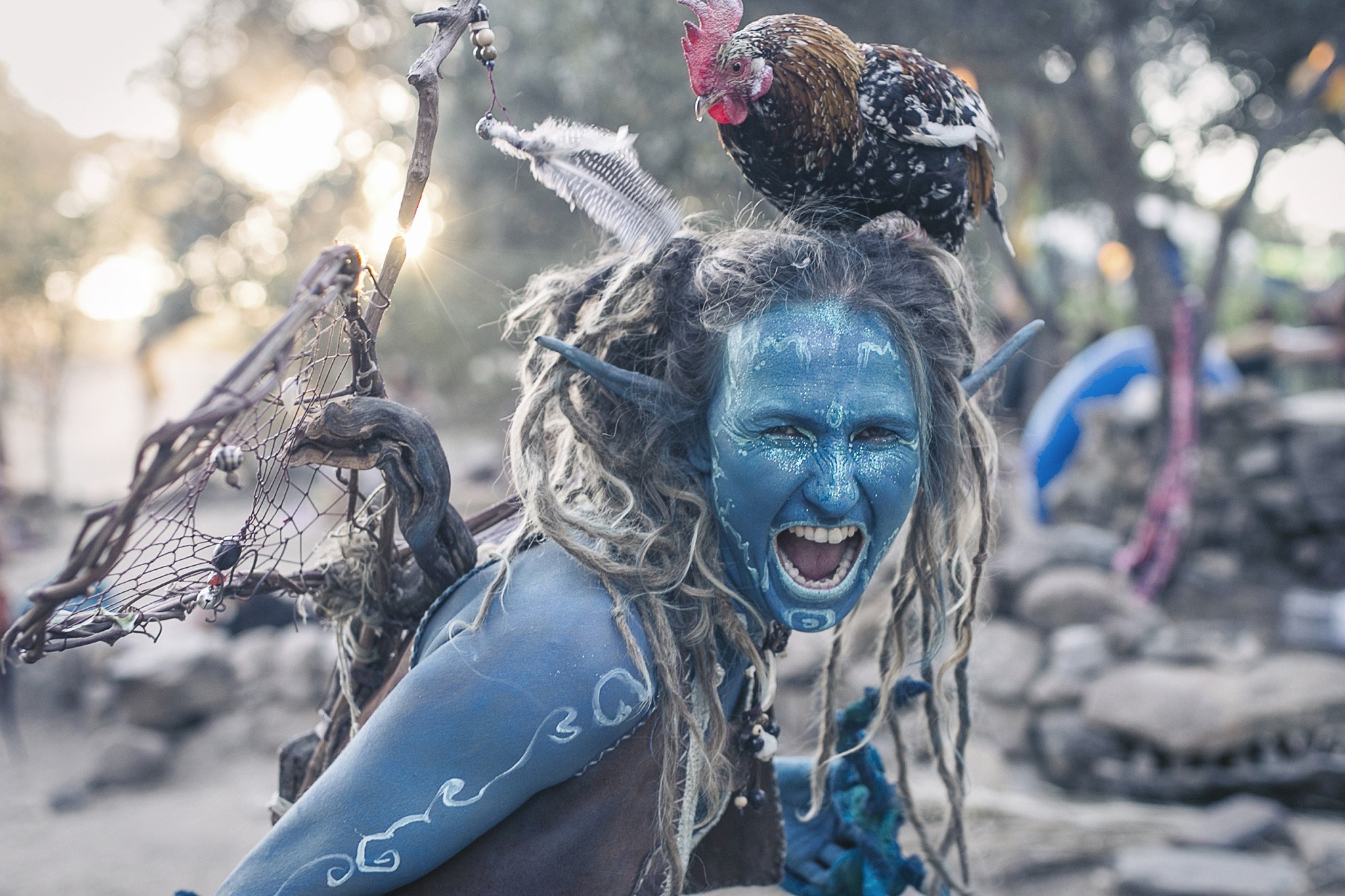 Woman with blue face paint and dreadlocks wearing a costume HD Wallpaper