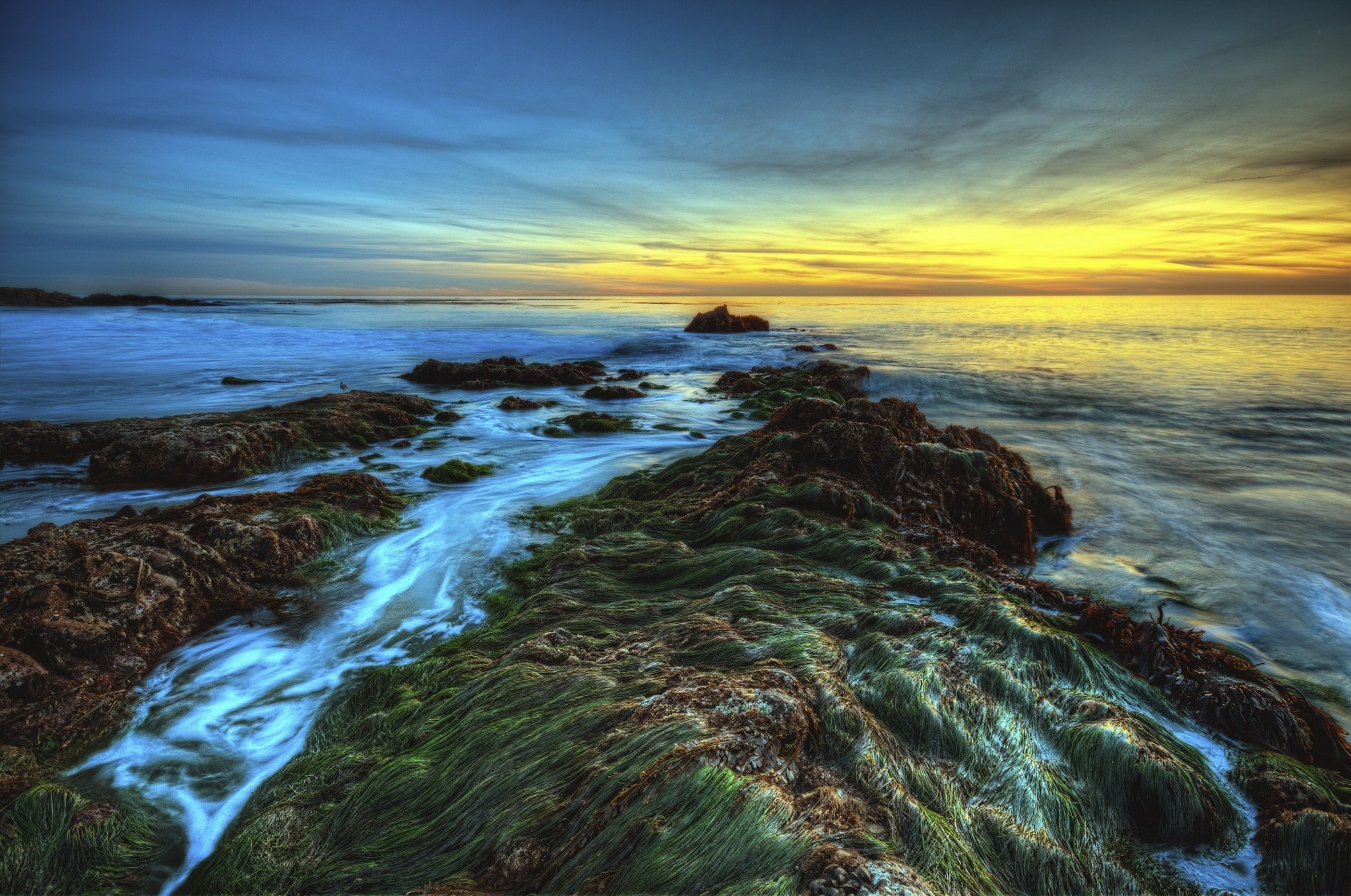 Sunset over rocky shore with ocean waves HD Wallpaper