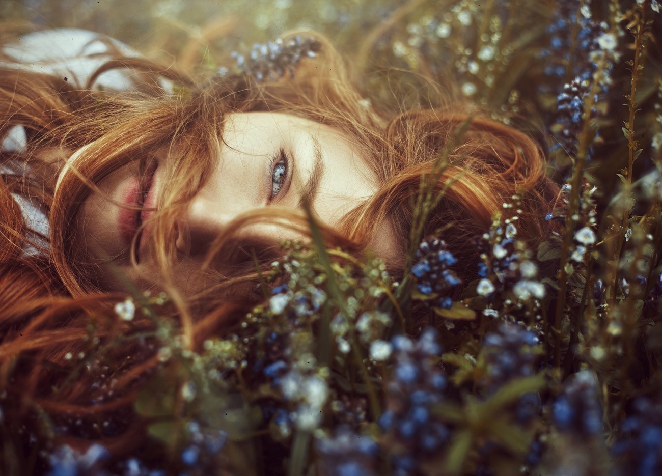 Redhead woman lying in flowers HD Wallpaper