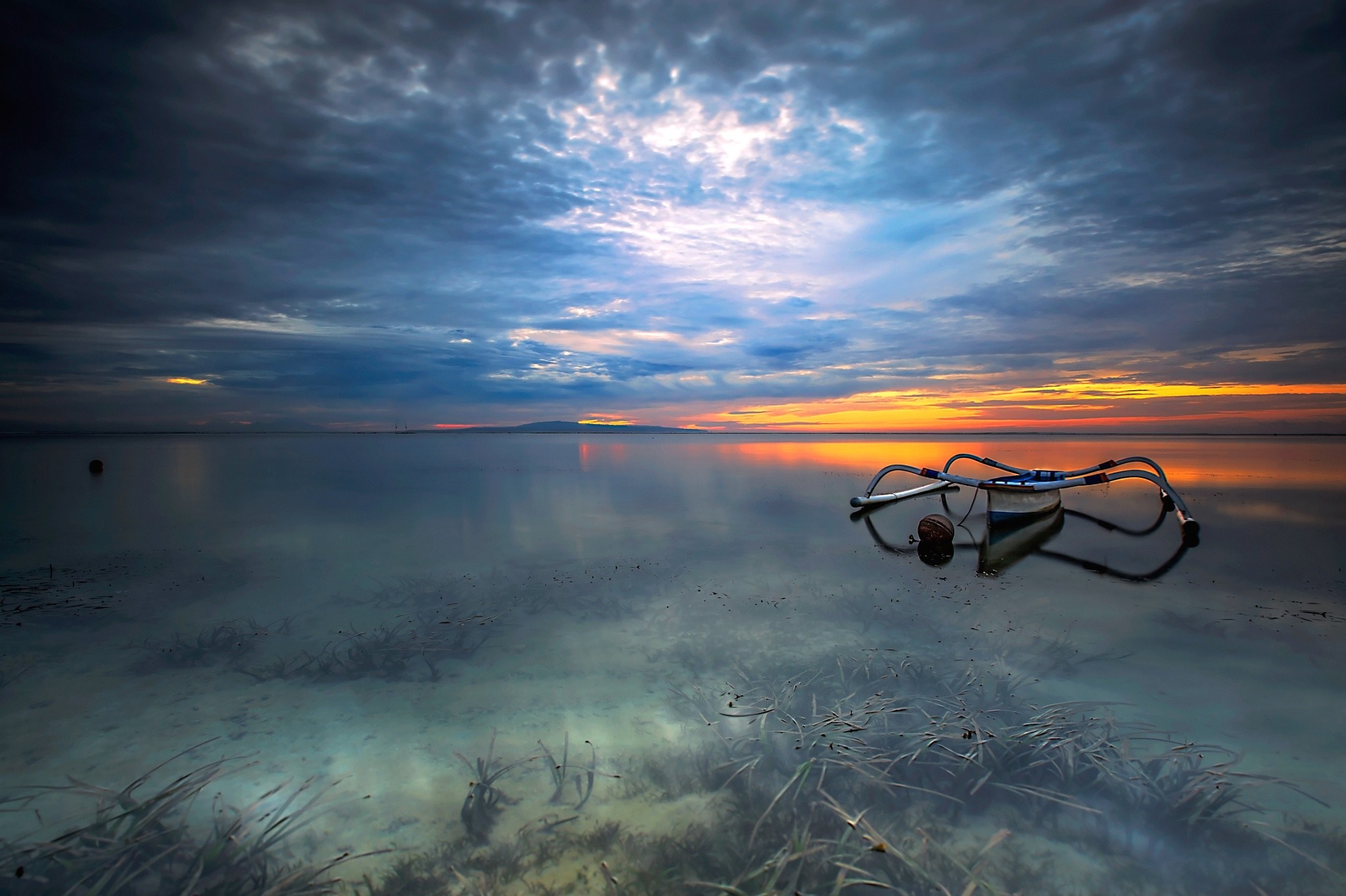 Sunset over a calm sea with a snorkel mask HD Wallpaper