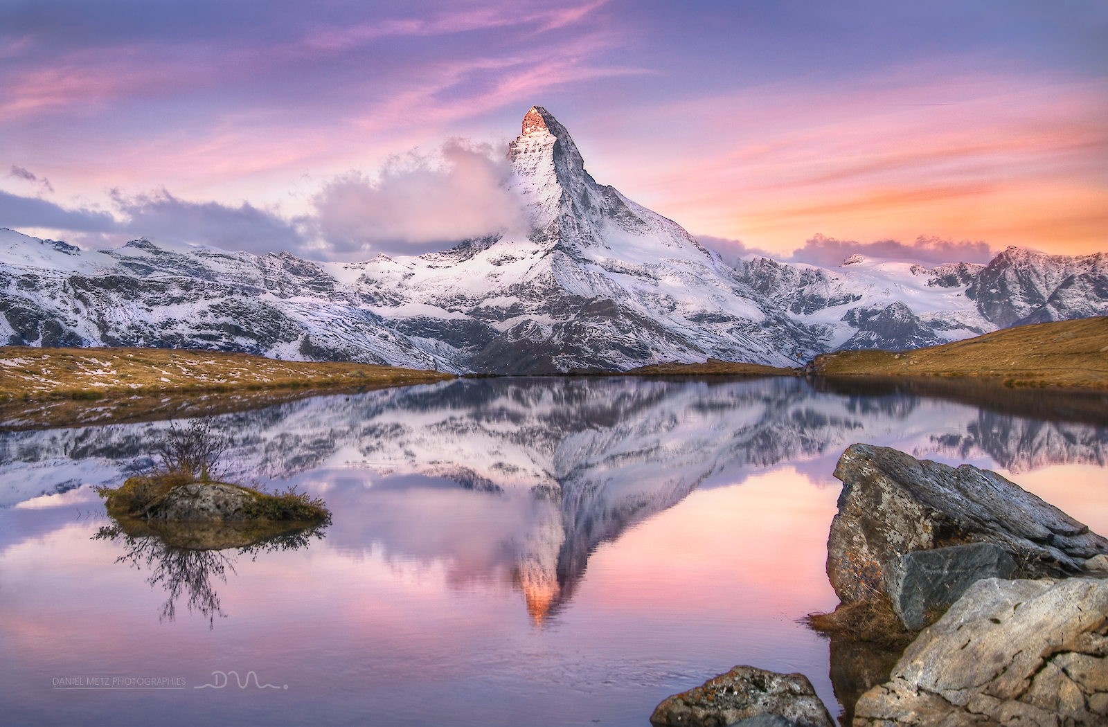 Matterhorn mountain reflected in a lake at sunset HD Wallpaper