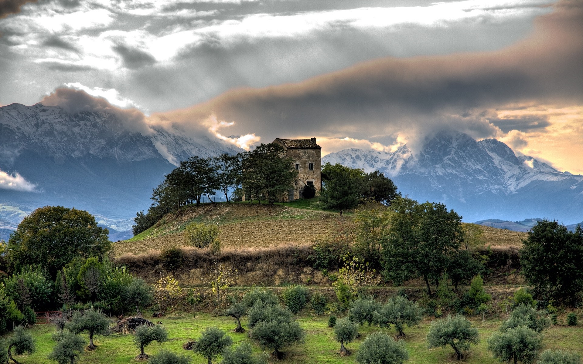 Old house on a hill with mountains and trees HD Wallpaper