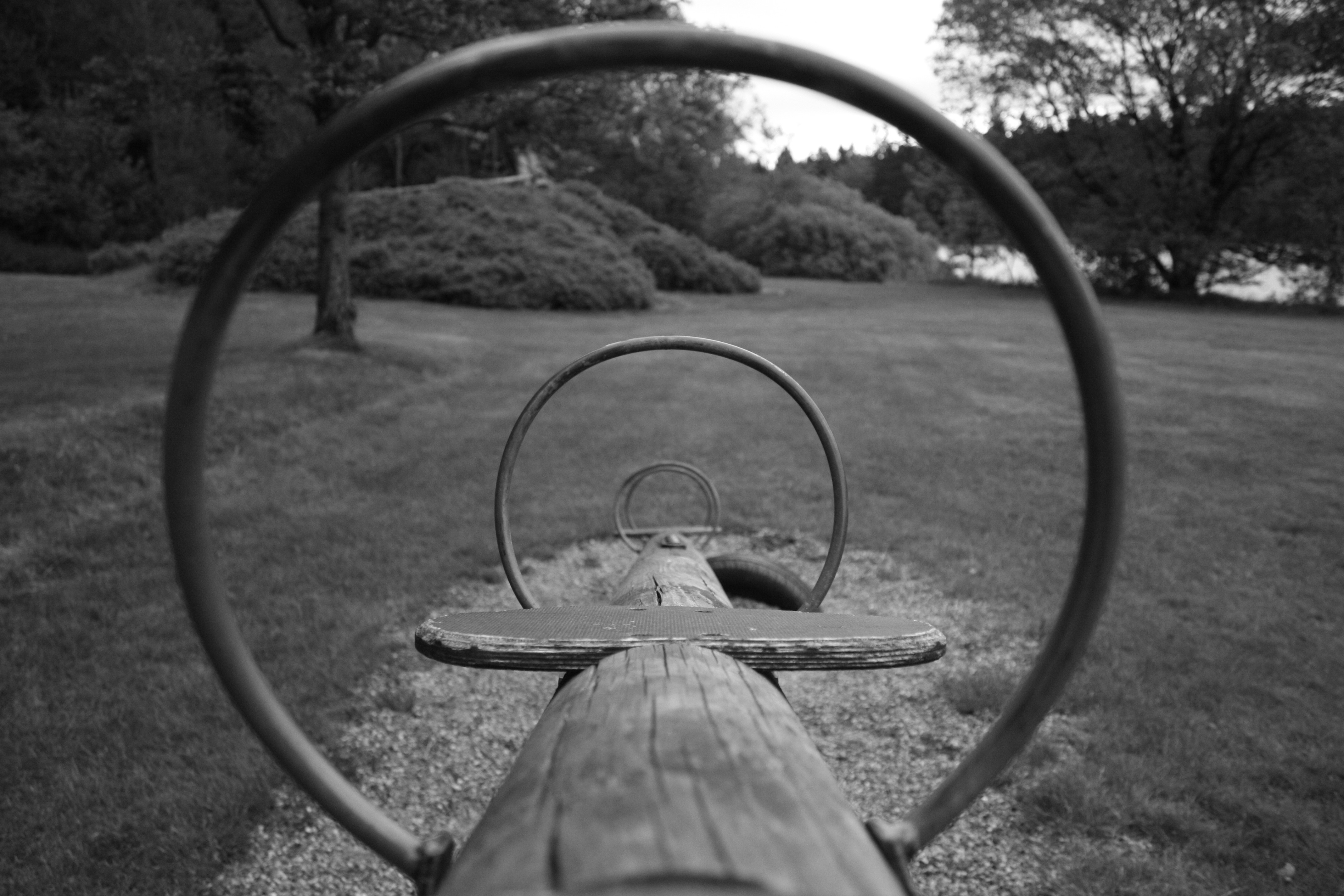 Seesaw on a grassy playground HD Wallpaper