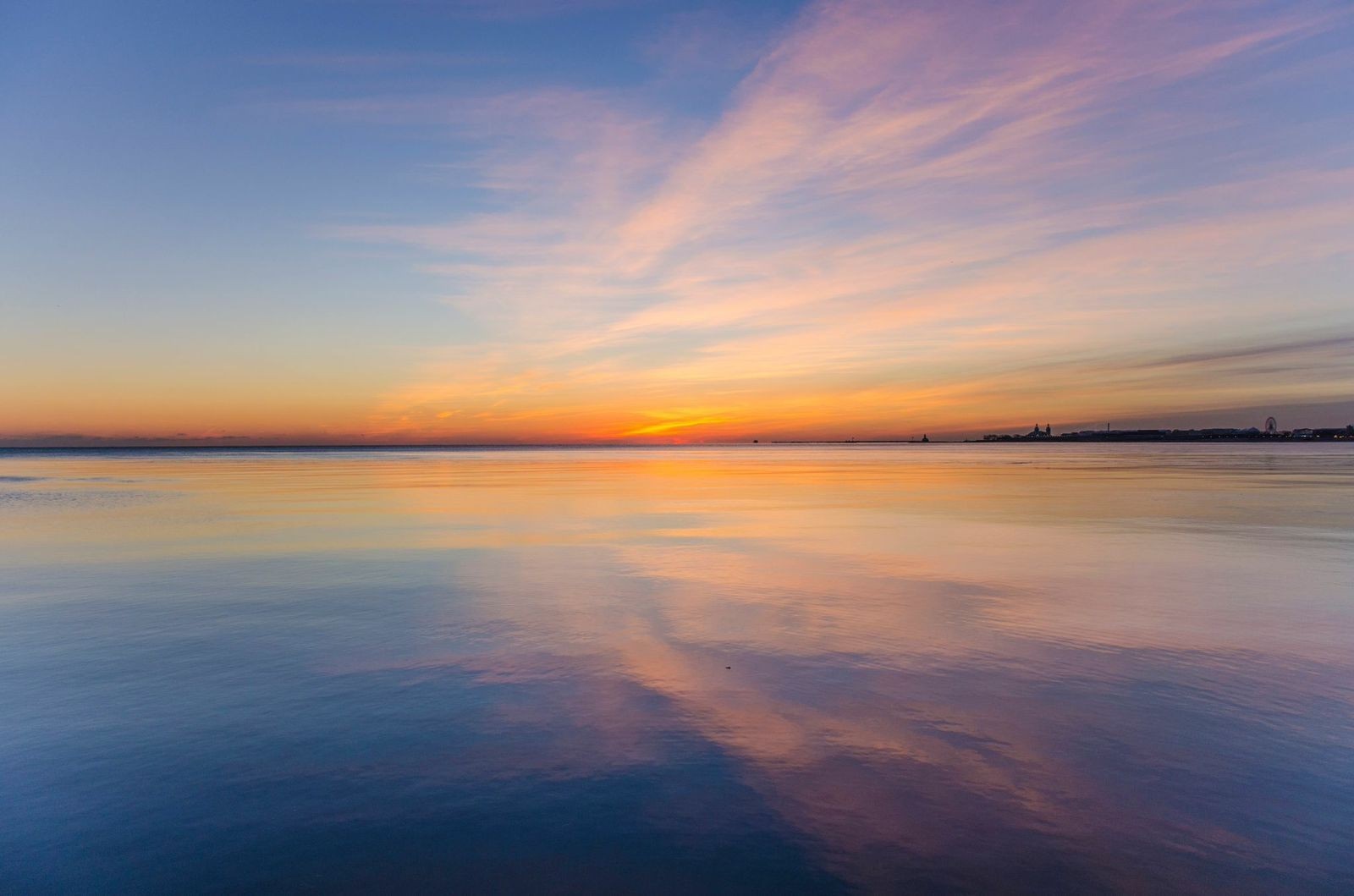 Sunset over the sea with colorful clouds and reflections HD Wallpaper