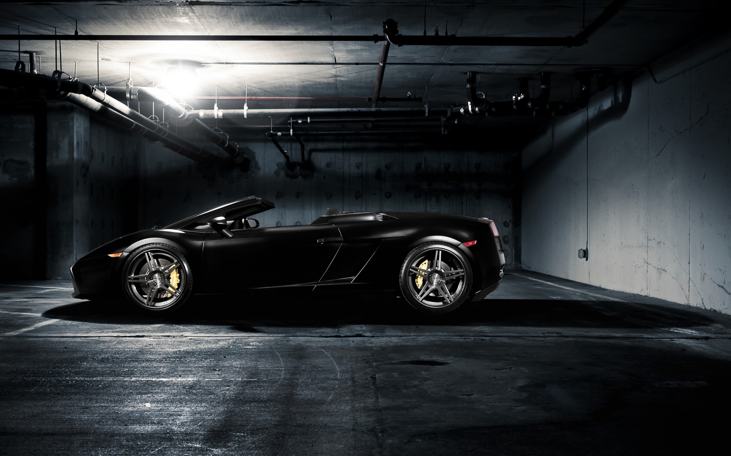 Black Lamborghini Gallardo convertible in a dark garage HD Wallpaper