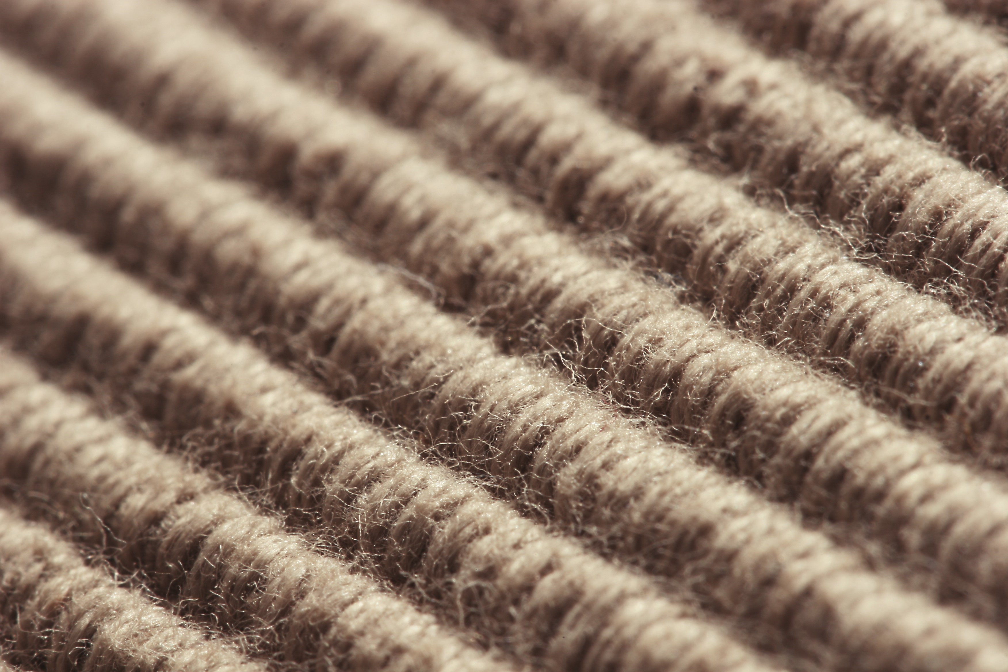 Close-up of brown ribbed carpet texture HD Wallpaper